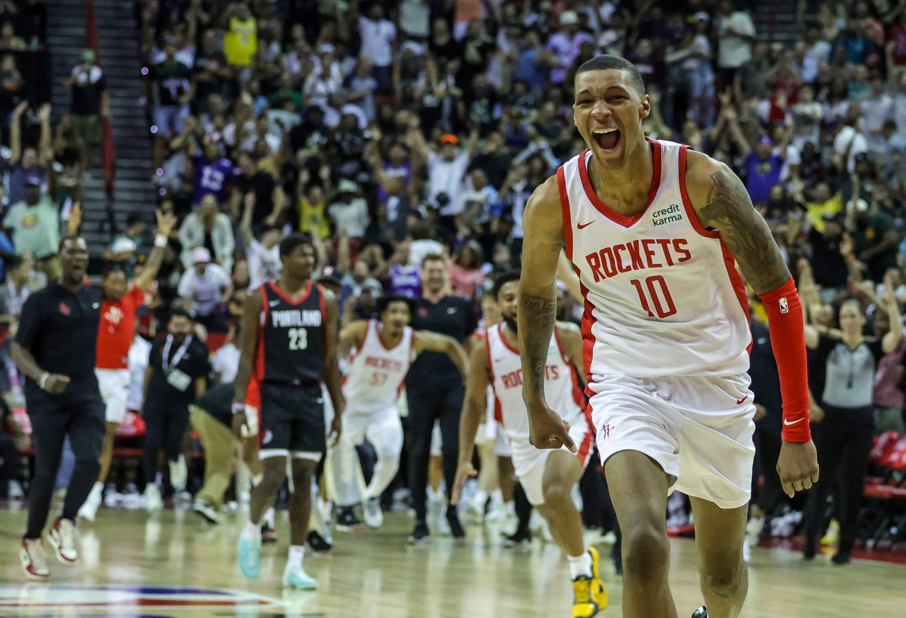 LAS VEGAS, NEVADA - JULY 07: Jabari Smith Jr. #10 of the Houston Rockets celebrates after hitting a game-winning 3-pointer against the Portland Trail Blazers with under a second left in a 2023 NBA Summer League game at the Thomas & Mack Center on July 07, 2023 in Las Vegas, Nevada. NOTE TO USER: User expressly acknowledges and agrees that, by downloading and or using this photograph, User is consenting to the terms and conditions of the Getty Images License Agreement. (Photo by Ethan Miller/Getty Images)