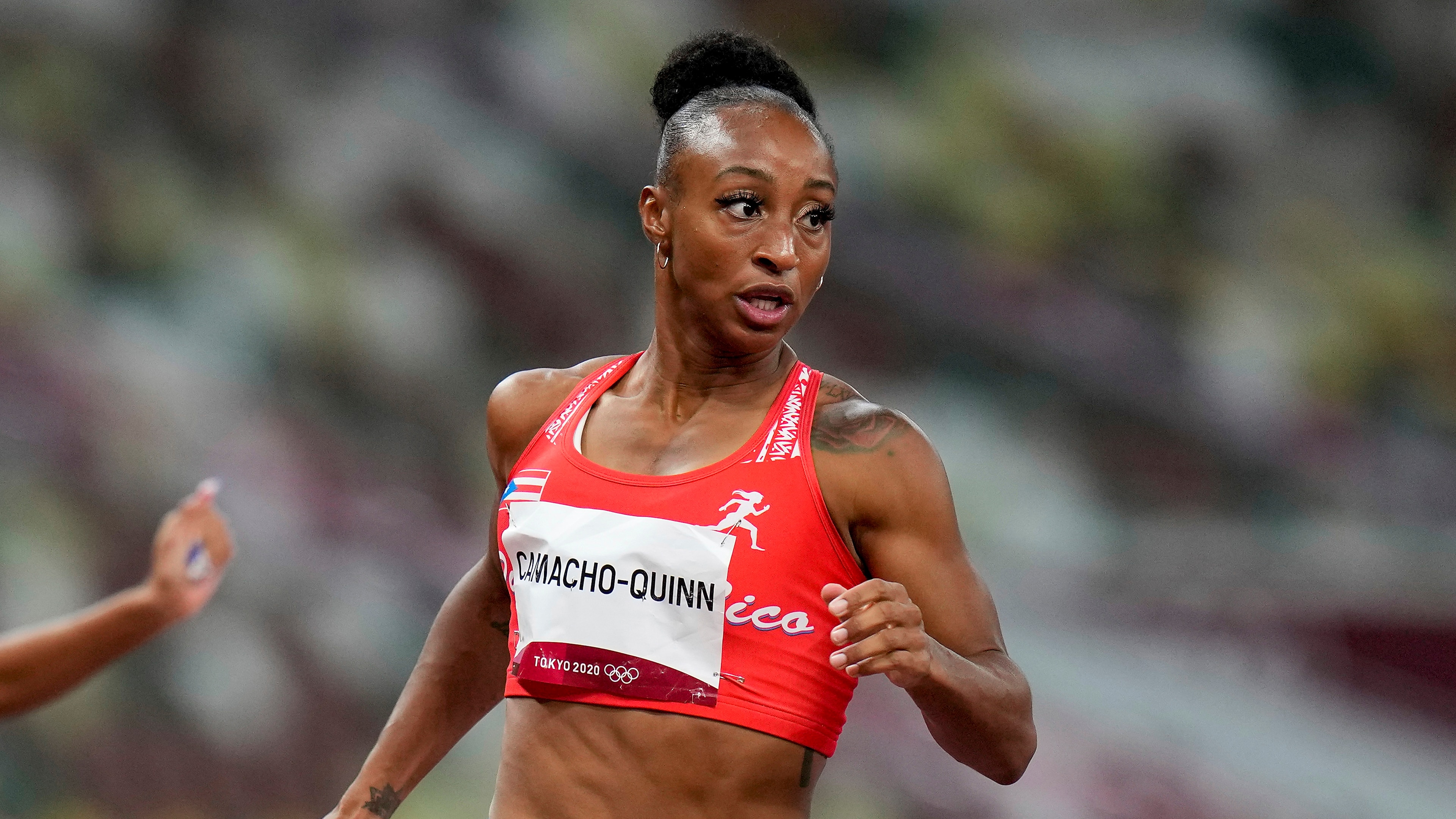 Jasmine Camacho-Quinn, of Puerto Rico, wins a women's 100-meter hurdles semifinal at the 2020 Summer Olympics, Sunday, Aug. 1, 2021, in Tokyo. (AP Photo/Petr David Josek)