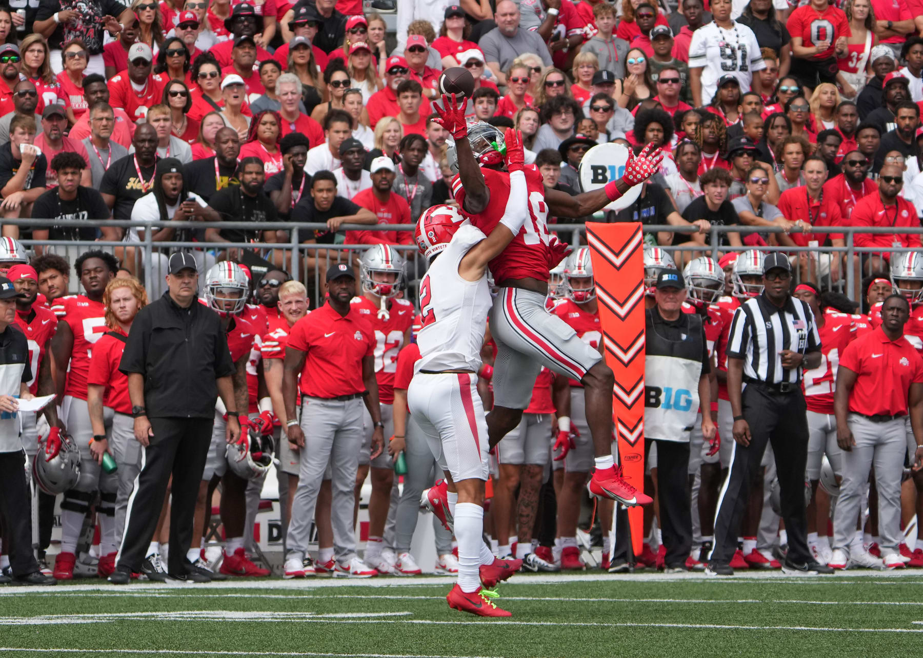 COLUMBUS, OH - SEPTEMBER 09: Wide receiver Marvin Harrison Jr. #18 of the Ohio State Buckeyes attempts to catch a pass while being guarded by defensive back Troy Jakubec #2 of the Youngstown State Penguins during the second quarter at Ohio Stadium in Columbus, Ohio on September 9, 2023. (Photo by Jason Mowry/Icon Sportswire via Getty Images)