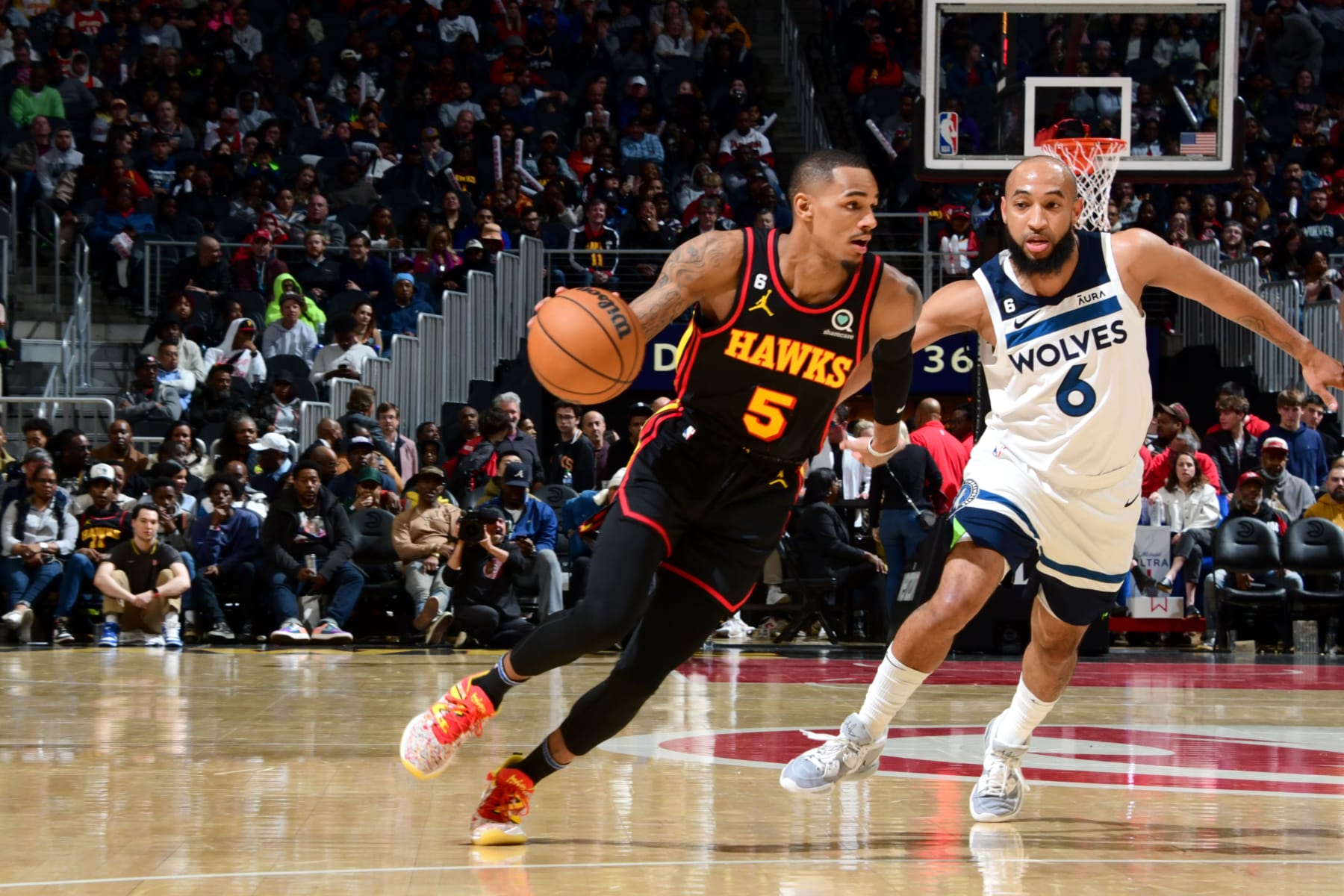 ATLANTA, GA - MARCH 13: Dejounte Murray #5 of the Atlanta Hawks moves the ball during the game against the Minnesota Timberwolves on March 13, 2023 at State Farm Arena in Atlanta, Georgia.  NOTE TO USER: User expressly acknowledges and agrees that, by downloading and/or using this Photograph, user is consenting to the terms and conditions of the Getty Images License Agreement. Mandatory Copyright Notice: Copyright 2023 NBAE (Photo by Scott Cunningham/NBAE via Getty Images)