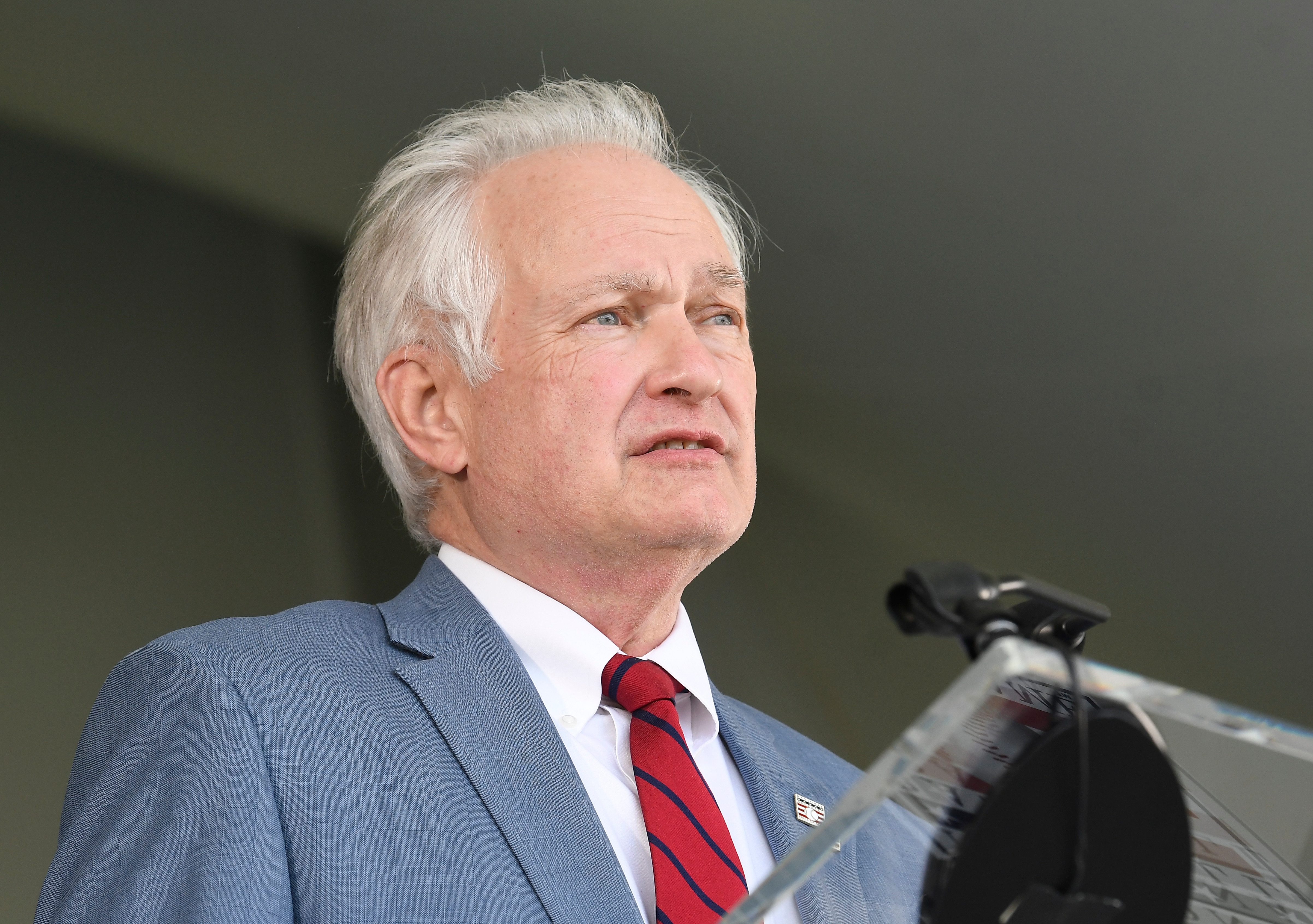Donald Fehr, accepting for the late Marvin Miller, speaks about Miller during at the Baseball Hall of Fame inductions Wednesday, Sept. 8, 2021, in Cooperstown, N.Y. (AP Photo/Hans Pennink)