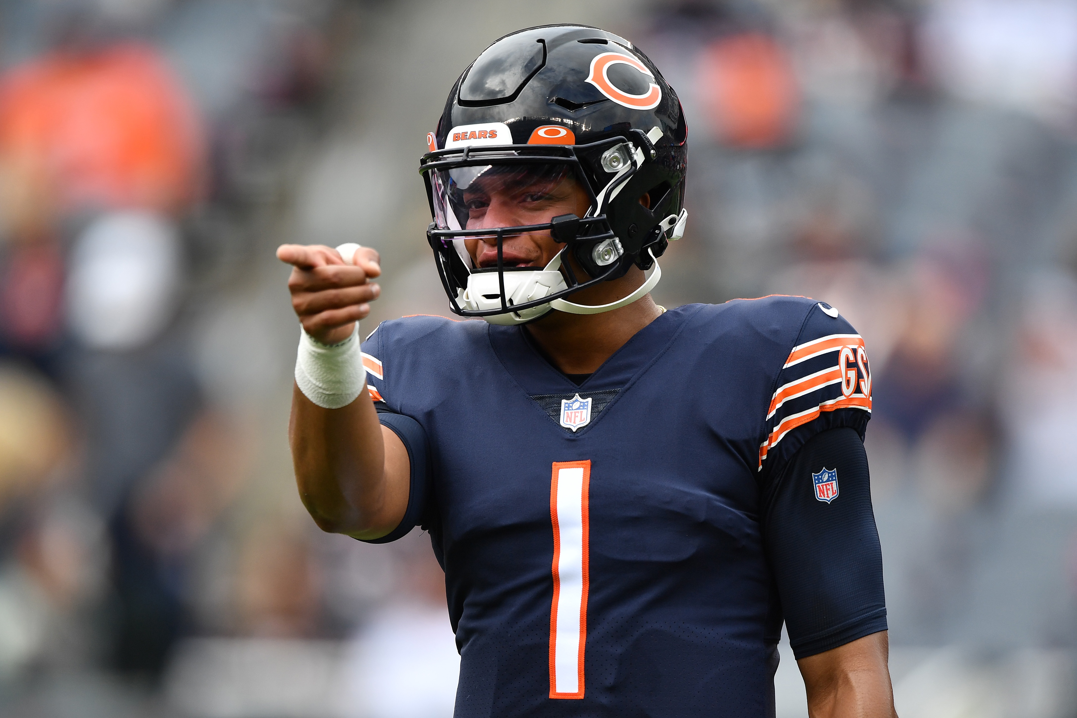 CHICAGO, ILLINOIS - OCTOBER 03: Justin Fields #1 of the Chicago Bears warms up before the game against the Detroit Lions at Soldier Field on October 03, 2021 in Chicago, Illinois. (Photo by Jamie Sabau/Getty Images)