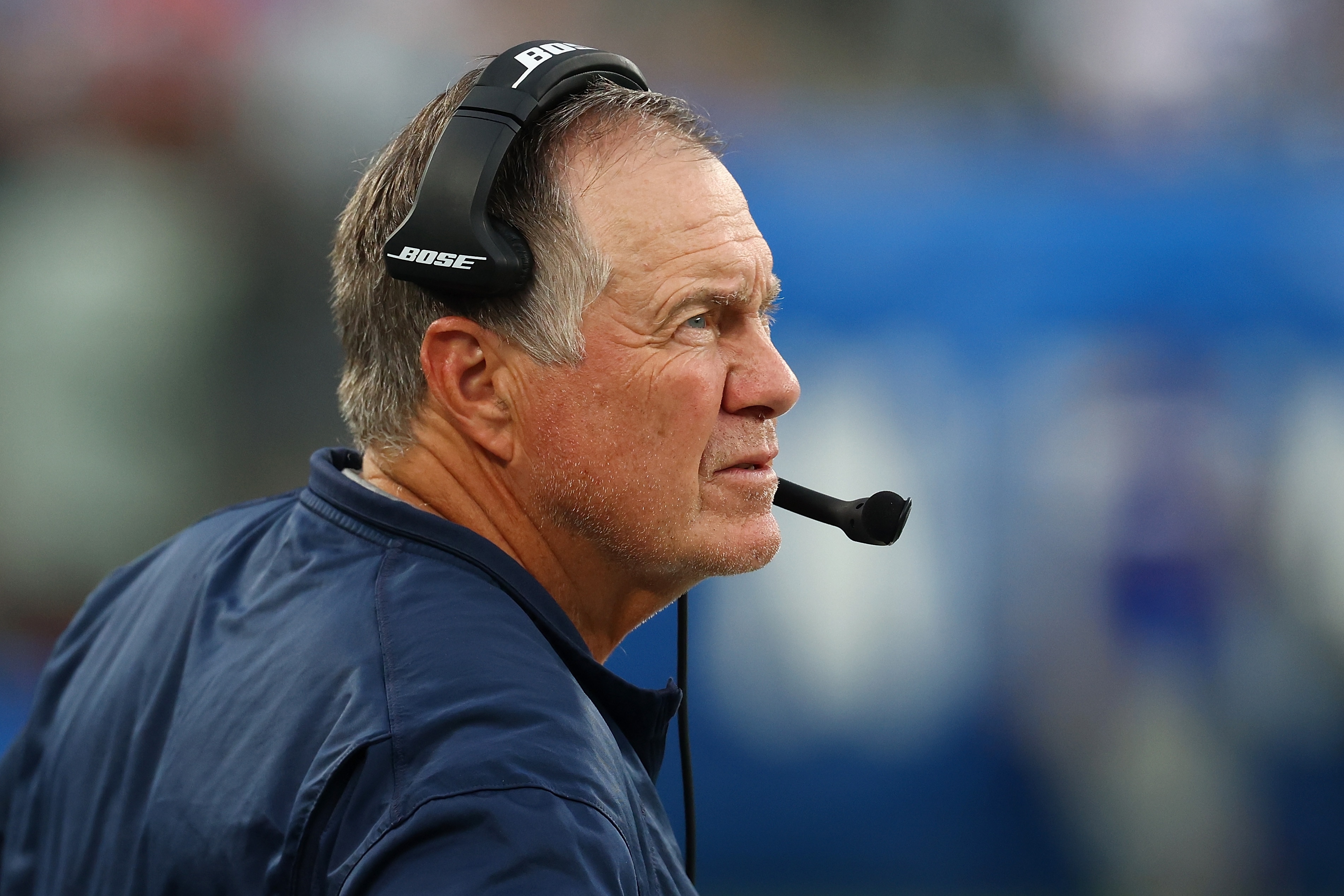 EAST RUTHERFORD, NEW JERSEY - AUGUST 29: Head Coach Bill Belichick of the New England Patriots looks on from the bench during the game against the New York Giants at MetLife Stadium on August 29, 2021 in East Rutherford, New Jersey. (Photo by Mike Stobe/Getty Images)
