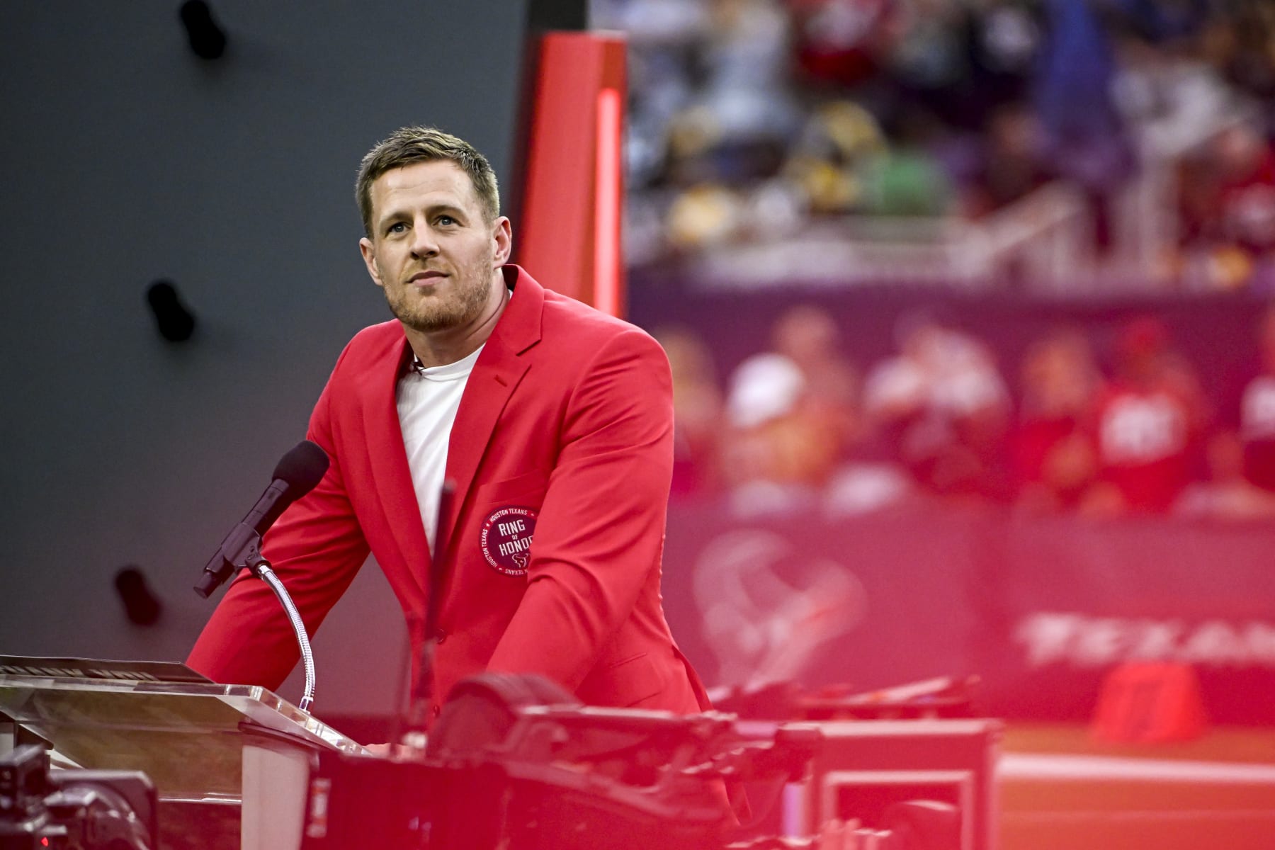 HOUSTON, TEXAS - OCTOBER 01: Former Houston Texans player J.J. Watt speaks during a ceremony inducting him into the Texans Ring of Honor during a game against the Pittsburgh Steelers at NRG Stadium on October 01, 2023 in Houston, Texas. (Photo by Logan Riely/Getty Images)