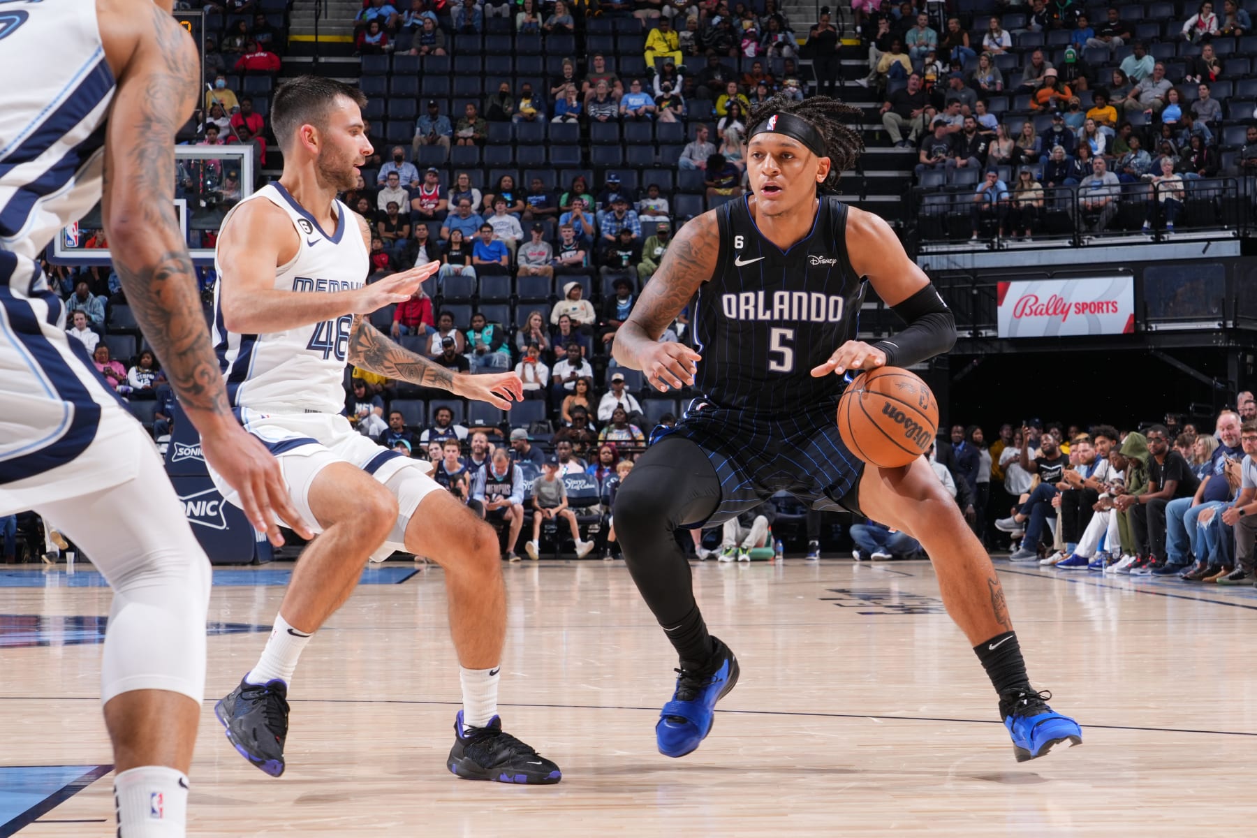 MEMPHIS, TN - OCTOBER 3: Paolo Banchero #5 of the Orlando Magic dribbles the ball during a preseason game on October 3, 2022 at FedExForum in Memphis, Tennessee. NOTE TO USER: User expressly acknowledges and agrees that, by downloading and or using this photograph, User is consenting to the terms and conditions of the Getty Images License Agreement. Mandatory Copyright Notice: Copyright 2022 NBAE (Photo by Jesse D. Garrabrant/NBAE via Getty Images)