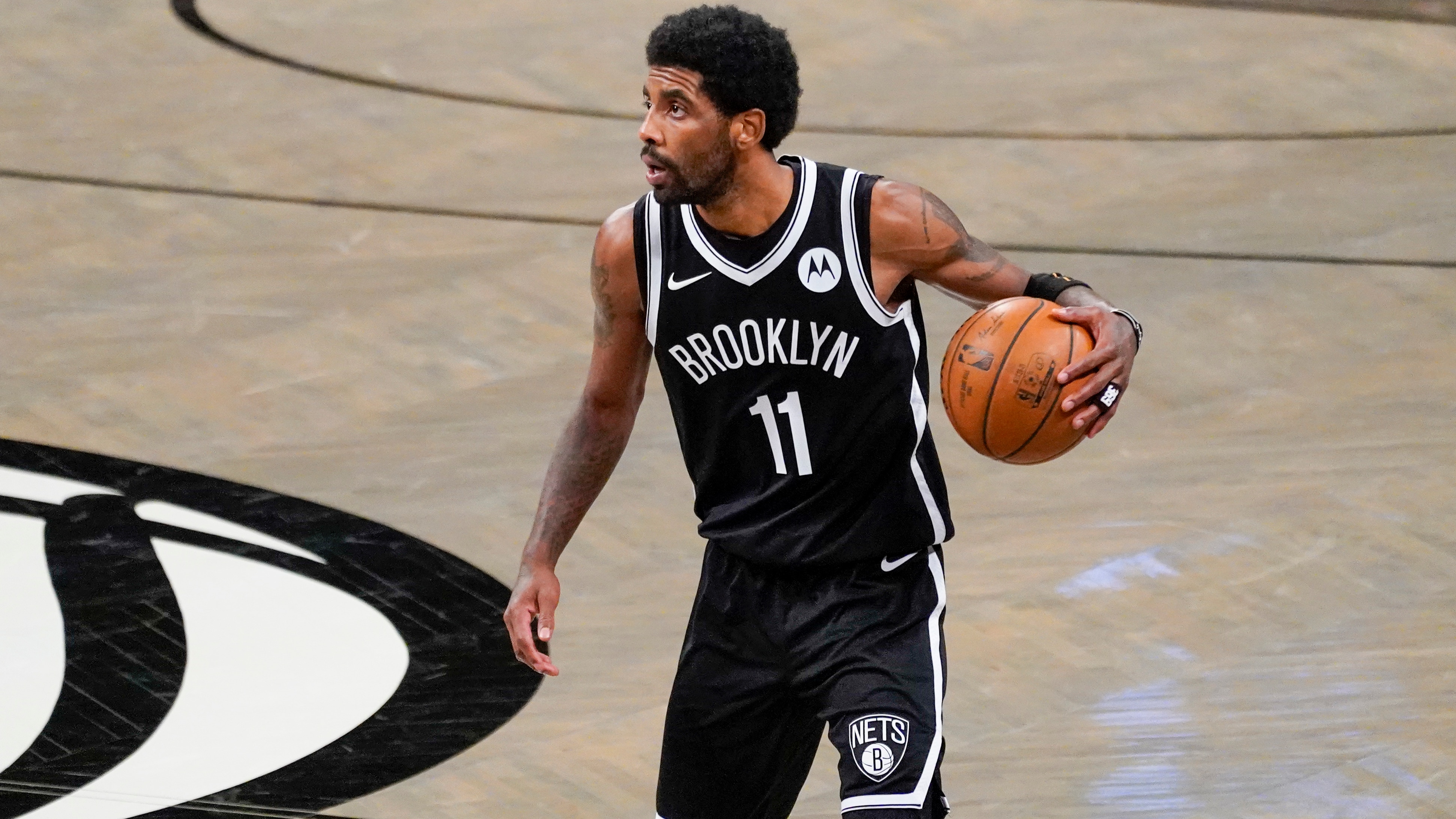 Brooklyn Nets guard Kyrie Irving handles the ball during the second half of an NBA basketball game against the Boston Celtics, Friday, April 23, 2021, in New York.The Nets won 109-104. (AP Photo/Mary Altaffer)