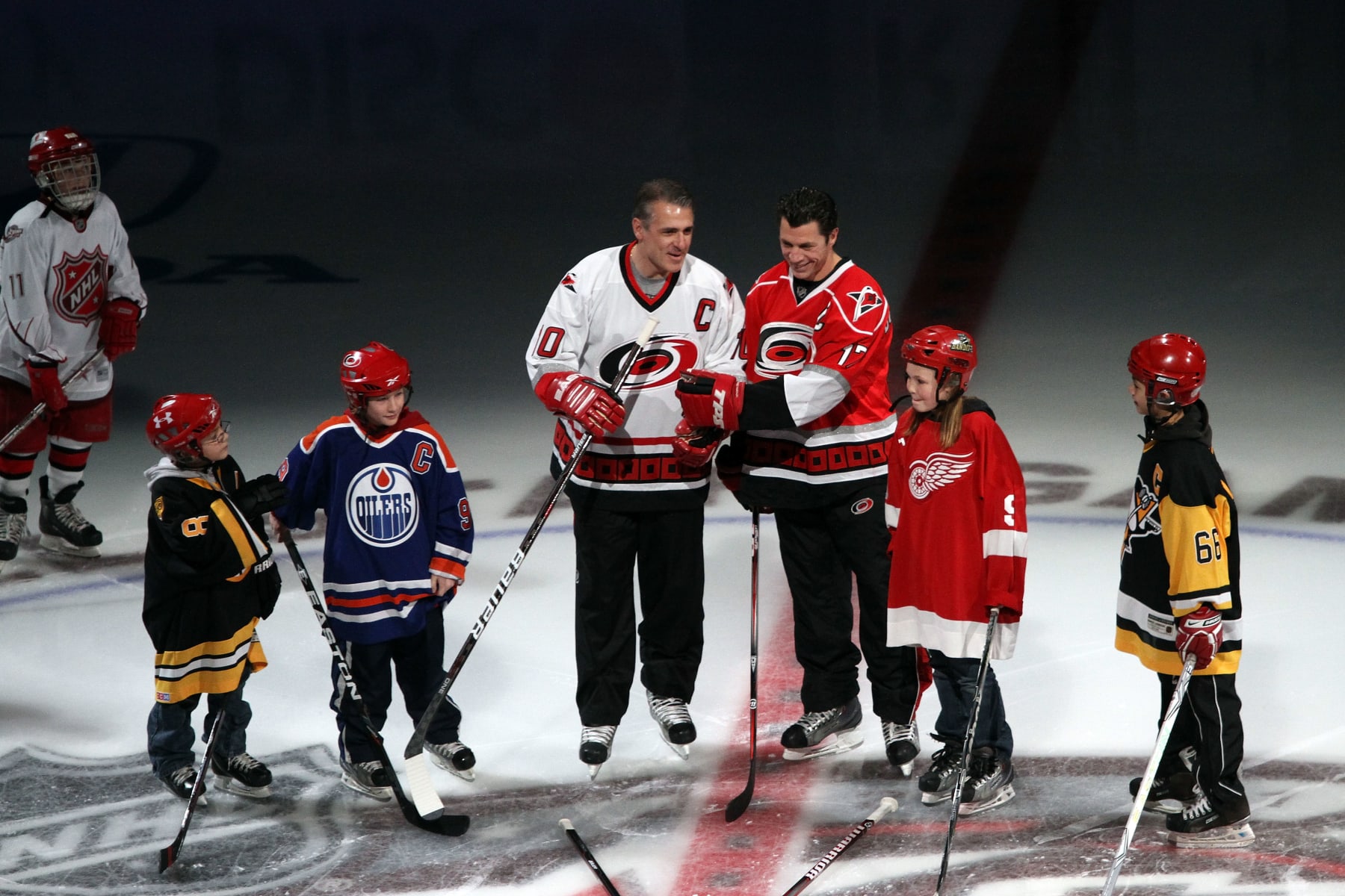 RALEIGH, NC - JANUARY 30:  (L-R)  Former NHL players Ron Francis and Rod Brind'Amour are seen on the ice with junior players during pregame festivities prior to the start of the 58th NHL All-Star Game at the RBC Center on January 30, 2011 in Raleigh, North Carolina.  (Photo by Gregg Forwerck/NHLI via Getty Images)