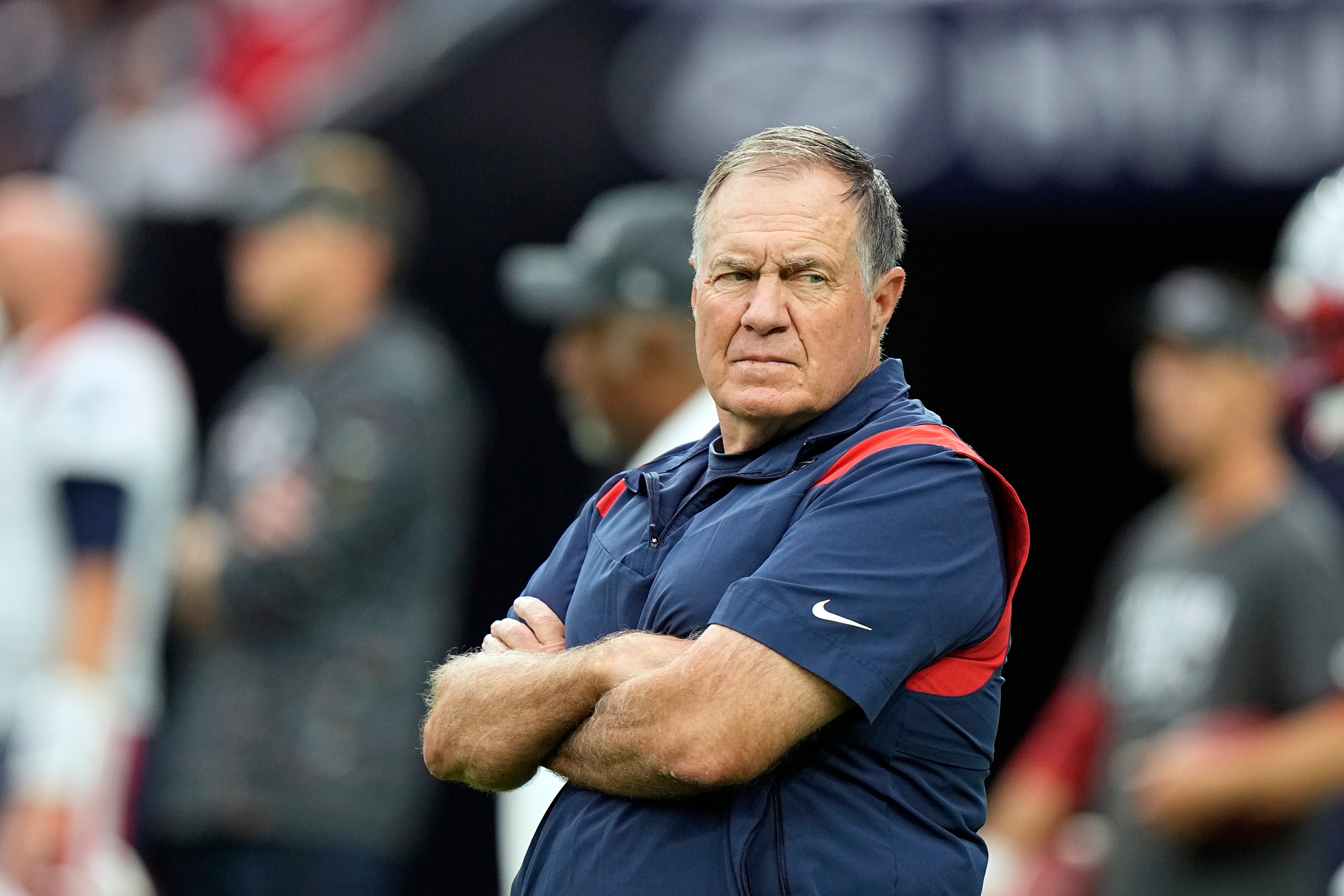 New England Patriots head coach Bill Belichick watches his team warm up before an NFL football game against the Houston Texans Sunday, Oct. 10, 2021, in Houston. (AP Photo/Eric Christian Smith)