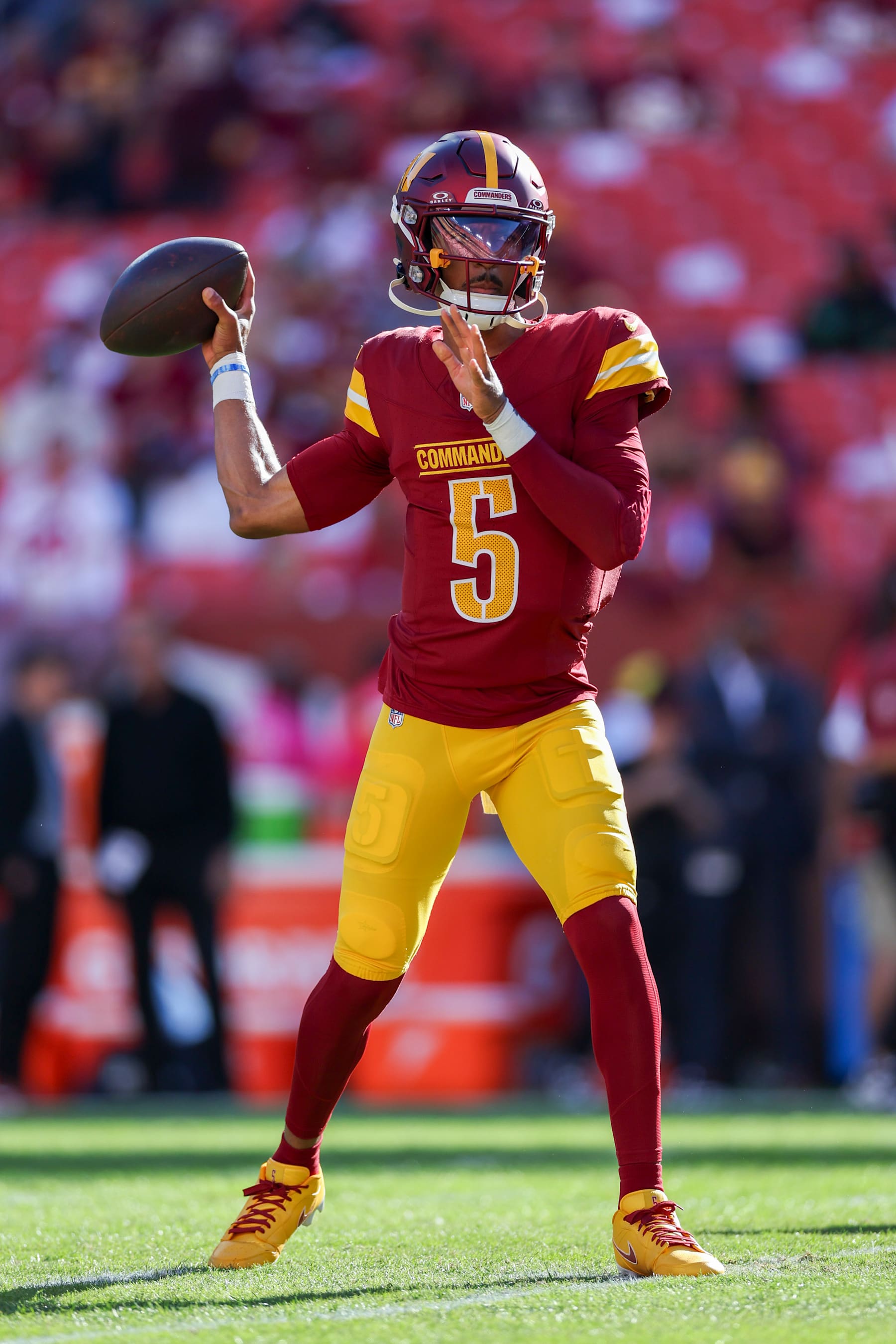 LANDOVER, MARYLAND - OCTOBER 20: Jayden Daniels #5 of the Washington Commanders warms up prior to the game against the Carolina Panthers at Northwest Stadium on October 20, 2024 in Landover, Maryland. (Photo by Patrick Smith/Getty Images)