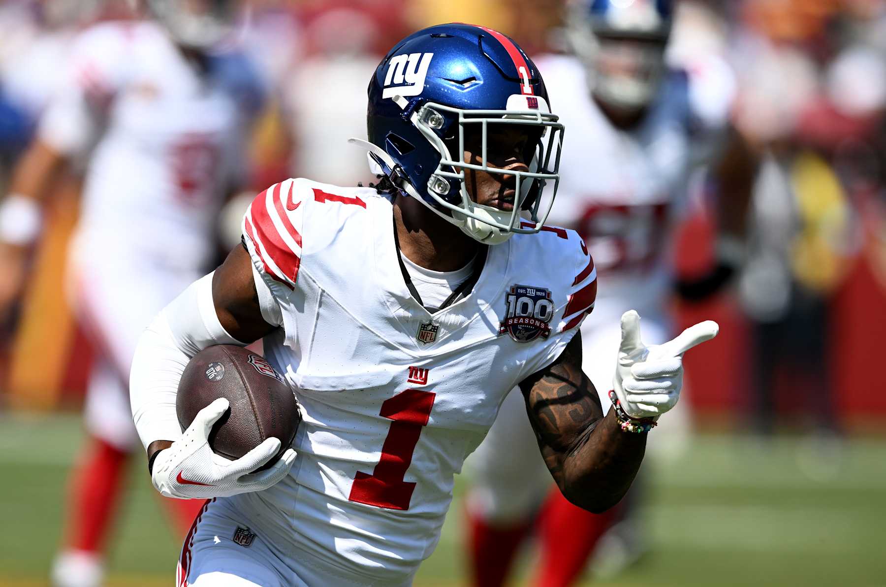 LANDOVER, MARYLAND - SEPTEMBER 15: Malik Nabers #1 of the New York Giants runs with the ball after a catch against the Washington Commanders at Northwest Stadium on September 15, 2024 in Landover, Maryland.  (Photo by G Fiume/Getty Images)