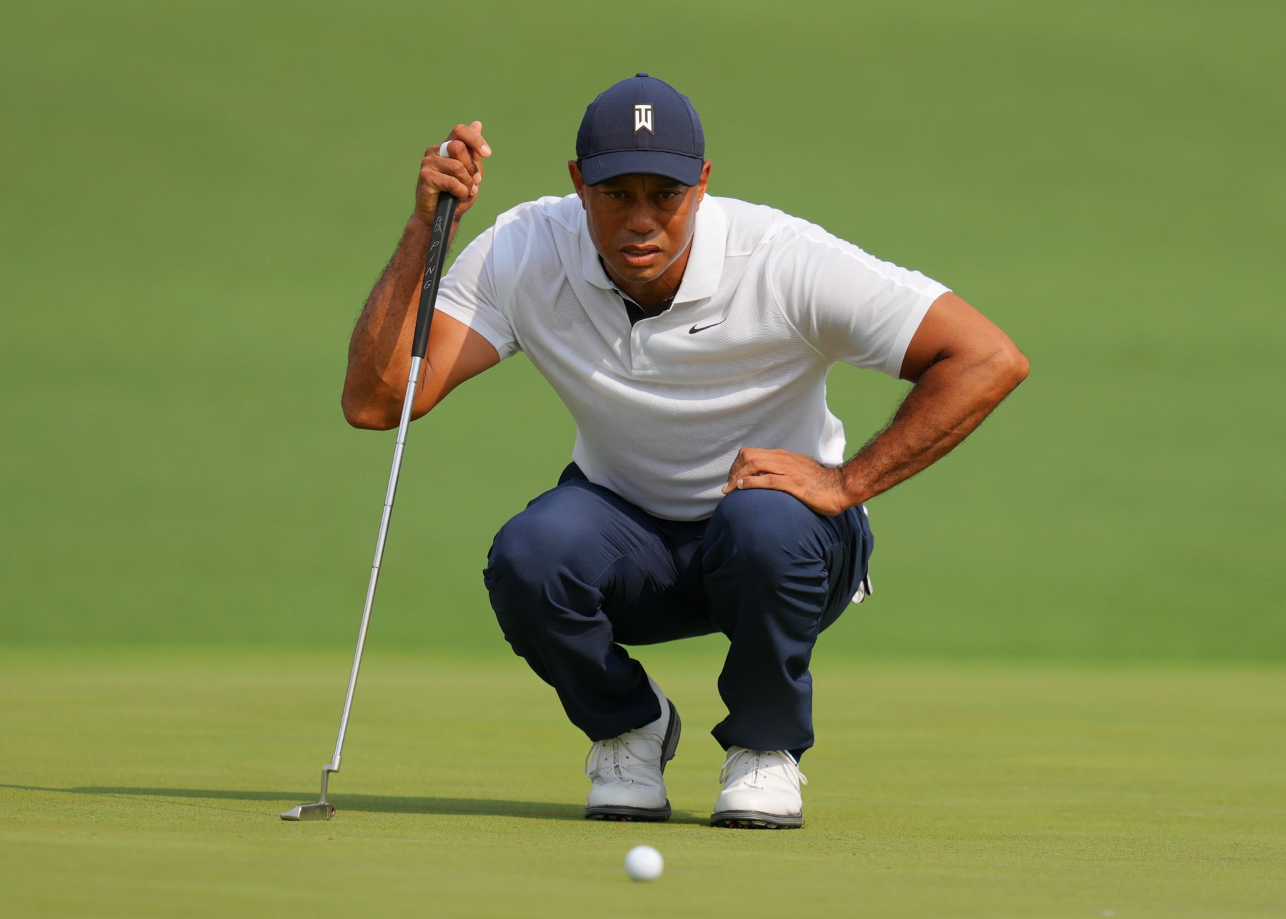 Tiger Woods of the United States lines up a putt during the first round of the 2023 Masters golf tournament at Augusta National Golf Club in Augusta, the United States, on April 6, 2023. (Photo by Wu Xiaoling/Xinhua via Getty Images)
