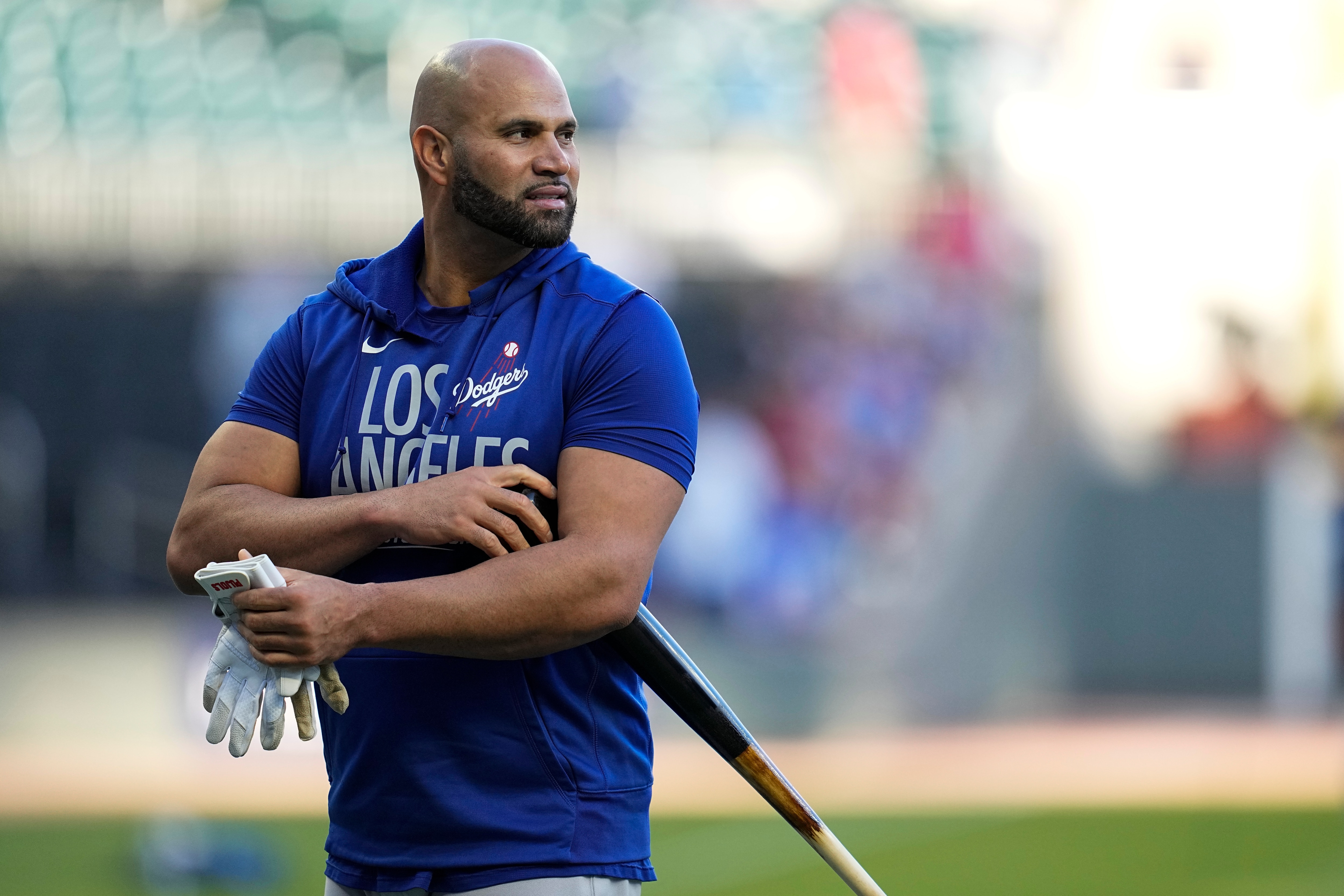 Los Angeles Dodgers first baseman Albert Pujols pauses as the team takes batting practice before Game 1 of baseball's National League Championship Series between the Atlanta Braves and the Dodgers on Saturday, Oct. 16, 2021, in Atlanta. (AP Photo/Ashley Landis)