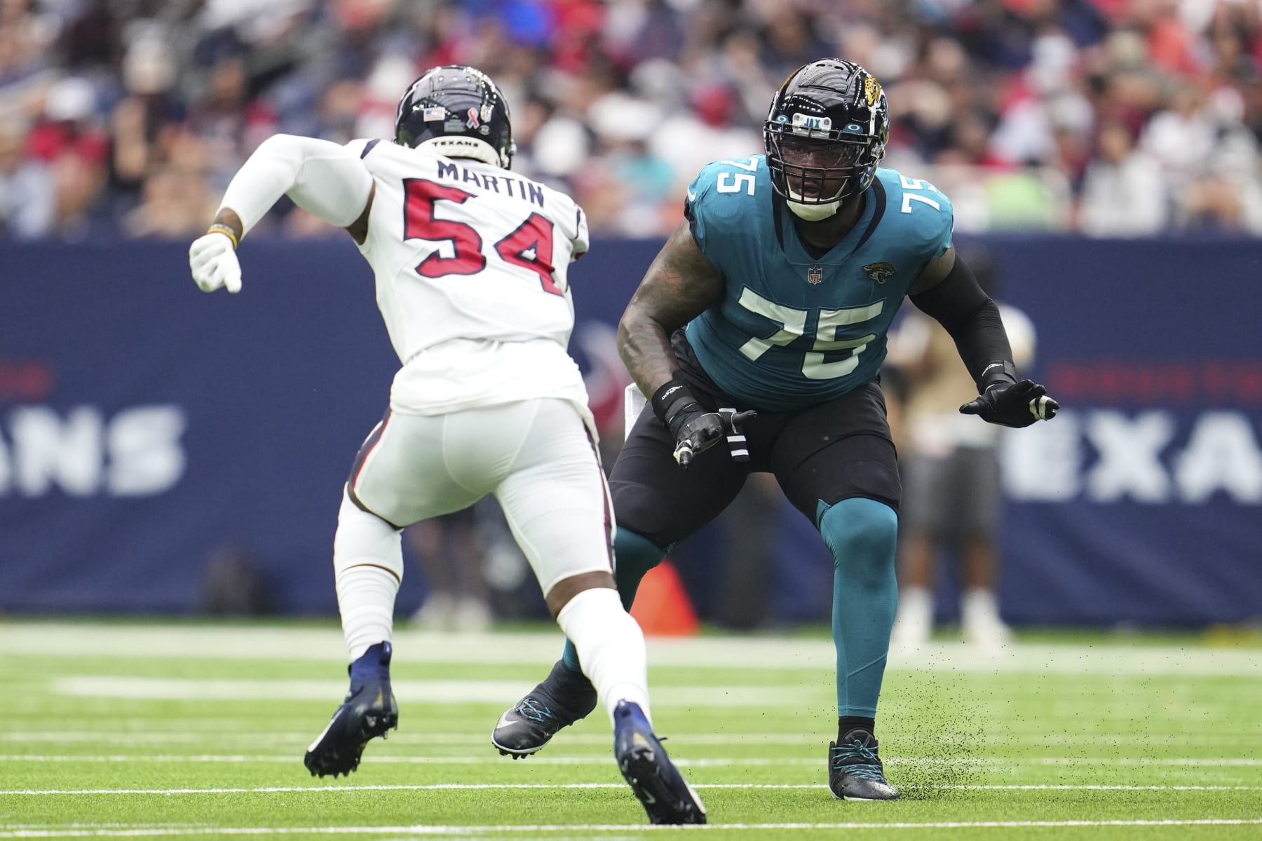 HOUSTON, TEXAS - SEPTEMBER 12: Jawaan Taylor #75 of the Jacksonville Jaguars defends the pocket against the Houston Texans during an NFL game at NRG Stadium on September 12, 2021 in Houston, Texas. (Photo by Cooper Neill/Getty Images)