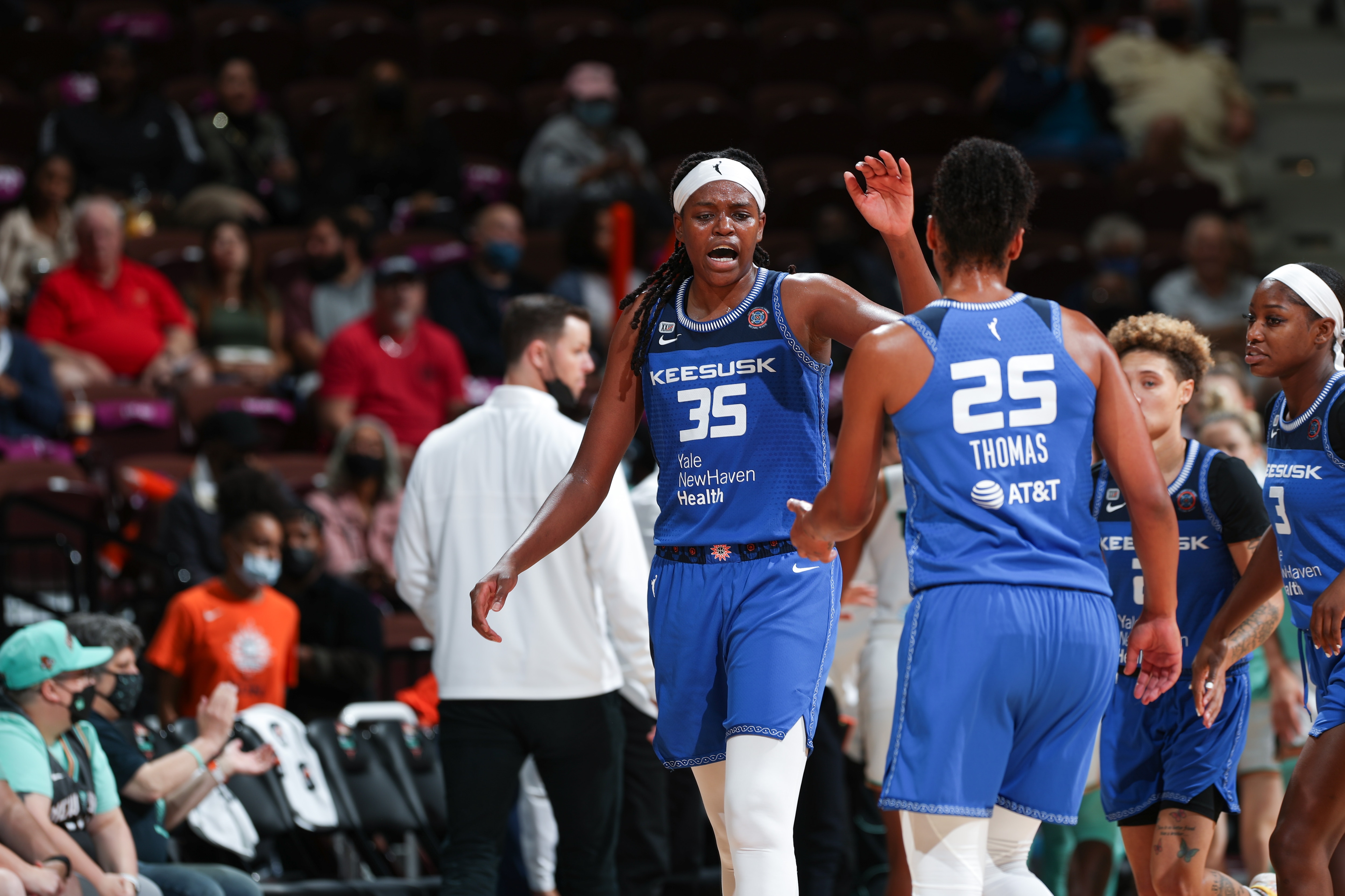 UNCASVILLE, CT - SEPTEMBER 15: Jonquel Jones #35 of the Connecticut Sun high fives Alyssa Thomas #25 of the Connecticut Sun during the game against the New York Liberty on September 15, 2021 at Mohegan Sun Arena in Uncasville, Connecticut. NOTE TO USER: User expressly acknowledges and agrees that, by downloading and or using this photograph, user is consenting to the terms and conditions of the Getty Images License Agreement. Mandatory Copyright Notice: Copyright 2021 NBAE (Photo by Chris Marion/NBAE via Getty Images)