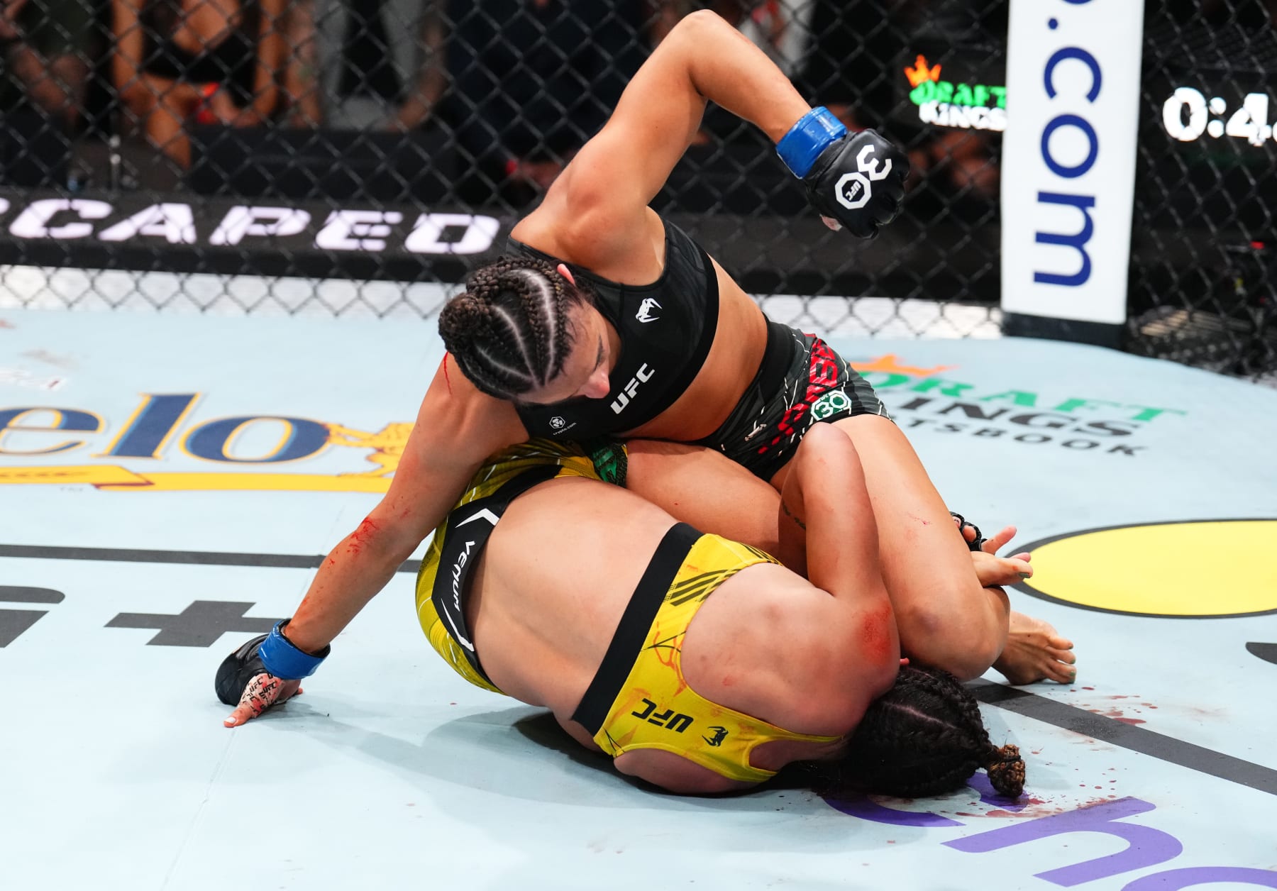 JACKSONVILLE, FLORIDA - JUNE 24:  Maycee Barber (top) punches Amanda Ribas of Brazil in their women's flyweight fight during the UFC Fight Night event at Vystar Veterans Memorial Arena on June 24, 2023 in Jacksonville, Florida. (Photo by Josh Hedges/Zuffa LLC)