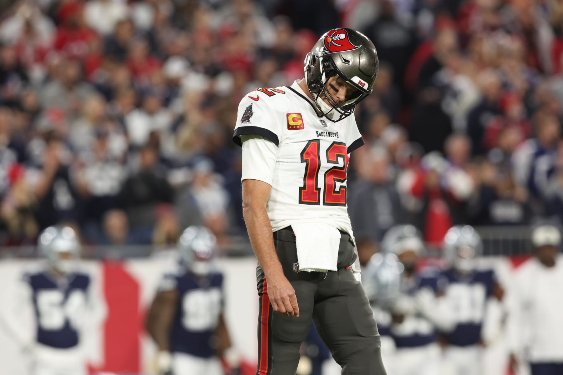 TAMPA, FLORIDA - JANUARY 16: Tom Brady  #12 of the Tampa Bay Buccaneers reacts on the field against the Dallas Cowboys  during the  NFC Wild Card Playoff game at Raymond James Stadium on January 16, 2023 in Tampa, Florida. (Perry Knotts/Getty Images)