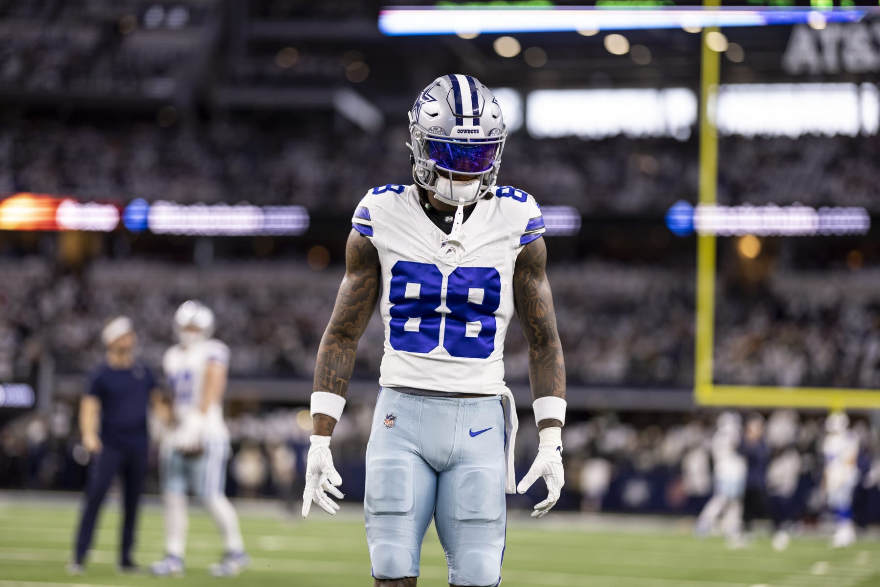 ARLINGTON, TEXAS - JANUARY 14: CeeDee Lamb #88 of the Dallas Cowboys looks on as he warms up prior to an NFL wild-card playoff football game between the Dallas Cowboys and the Green Bay Packers at AT&T Stadium on January 14, 2024 in Arlington, Texas. (Photo by Michael Owens/Getty Images)