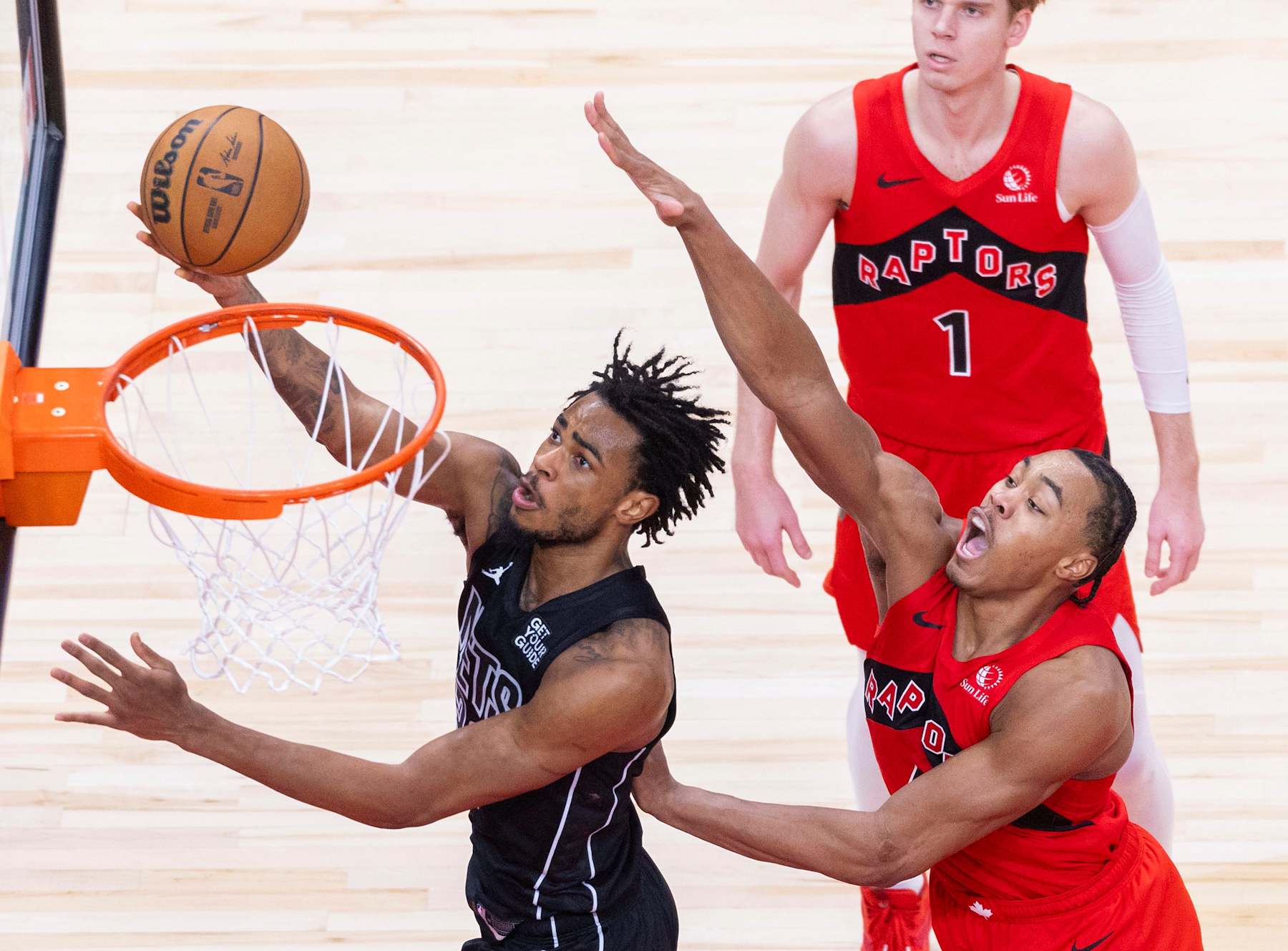 Nic Claxton L of Brooklyn Nets goes up for a layup during the 2024-2025 NBA regular season game between Toronto Raptors and Brooklyn Nets in Toronto, Canada, Jan. 1, 2025. (Photo by Zou Zheng/Xinhua via Getty Images)