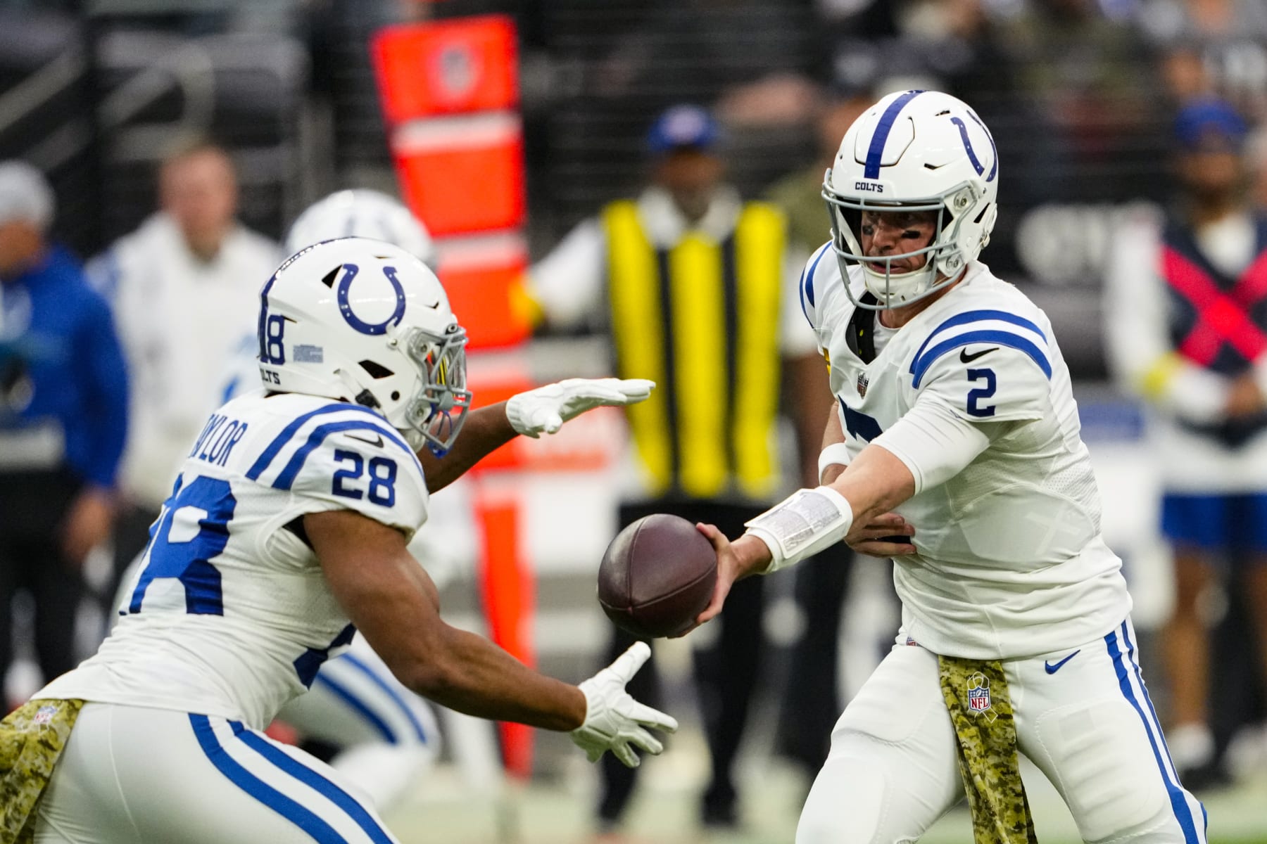 Indianapolis Colts quarterback Matt Ryan (2) hands off to running back Jonathan Taylor in the first half of an NFL football game against the Las Vegas Raiders in Las Vegas, Sunday, Nov. 13, 2022. (AP Photo/Matt York)