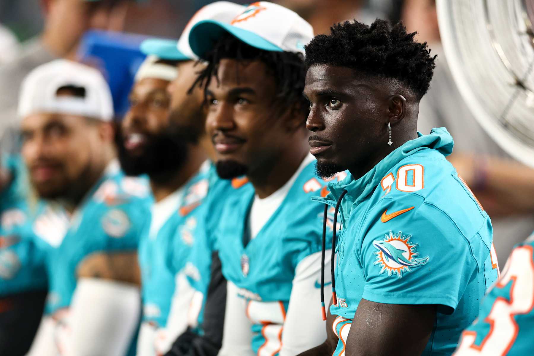 MIAMI GARDENS, FL - AUGUST 17: Tyreek Hill #10 of the Miami Dolphins sits on the bench during the third quarter of an NFL preseason football game against the Washington Commanders at Hard Rock Stadium on August 17, 2024 in Miami Gardens, FL. (Photo by Kevin Sabitus/Getty Images)