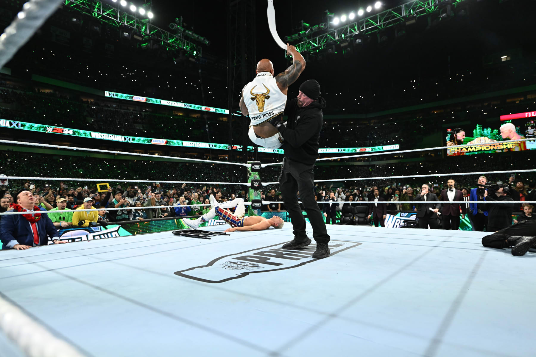 PHILADELPHIA, PENNSYLVANIA - APRIL 7: The Rock and The Undertaker fight on Night Two of WrestleMania 40 at Lincoln Financial Field on April 7, 2024 in Philadelphia, Pennsylvania. (Photo by WWE/Getty Images)