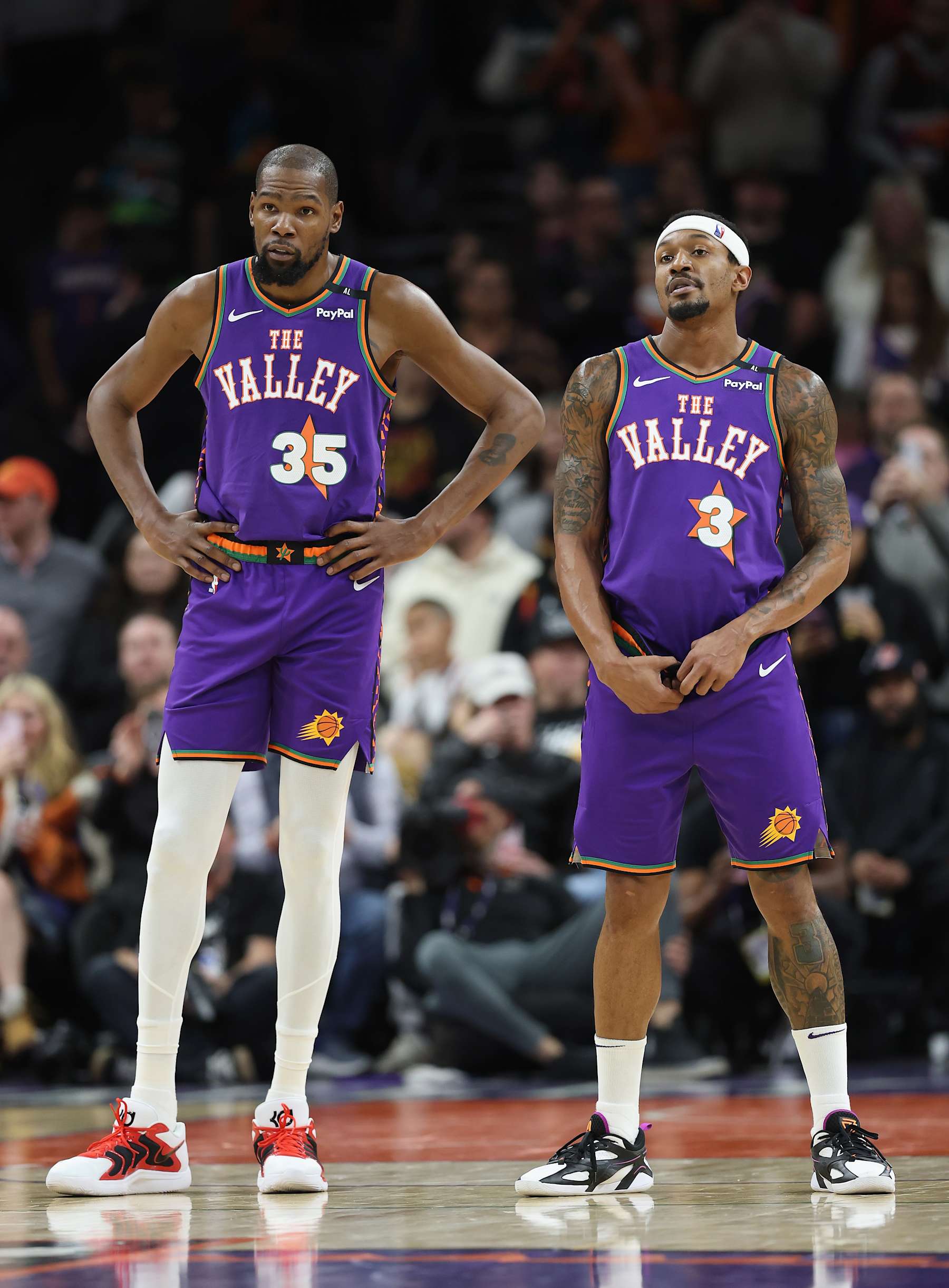 PHOENIX, ARIZONA - JANUARY 12: Kevin Durant #35 and Bradley Beal #3 of the Phoenix Suns during the second half of the NBA game at Footprint Center on January 12, 2025 in Phoenix, Arizona. The Suns defeated the Hornets 120-113. NOTE TO USER: User expressly acknowledges and agrees that, by downloading and or using this photograph, User is consenting to the terms and conditions of the Getty Images License Agreement.  (Photo by Christian Petersen/Getty Images)