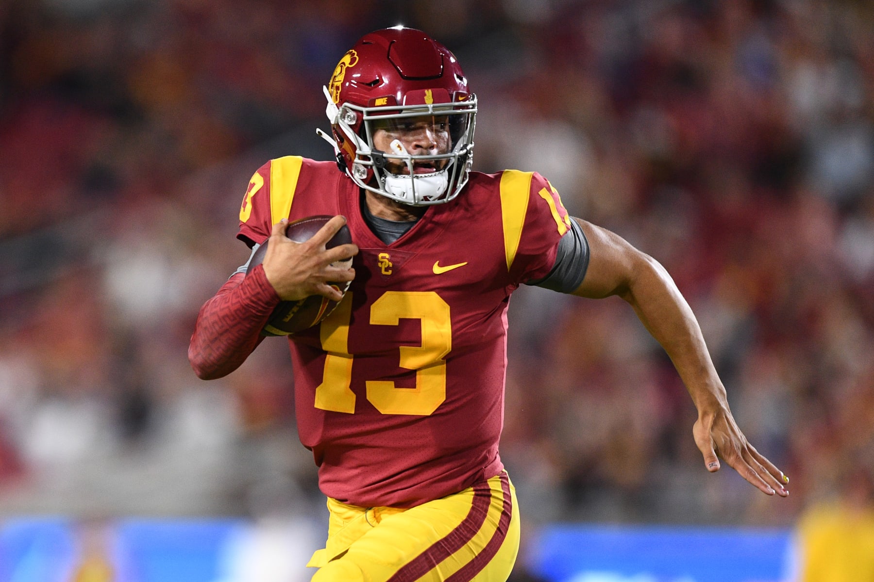 LOS ANGELES, CA - OCTOBER 01: USC Trojans quarterback Caleb Williams (13) runs the ball before throwing a touchdown pass during college football game between the Arizona State Sun Devils and the USC Trojans on October 1, 2022, at Los Angeles Memorial Coliseum in Los Angeles, CA. (Photo by Brian Rothmuller/Icon Sportswire via Getty Images)