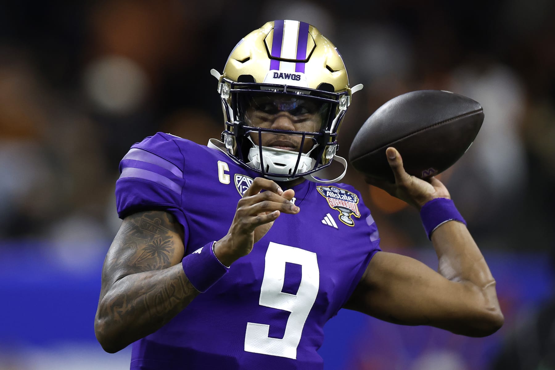 NEW ORLEANS, LOUISIANA - JANUARY 01: Michael Penix Jr. #9 of the Washington Huskies warms up prior to playing against the Texas Longhorns in the CFP Semifinal Allstate Sugar Bowl at Caesars Superdome on January 01, 2024 in New Orleans, Louisiana. (Photo by Chris Graythen/Getty Images)