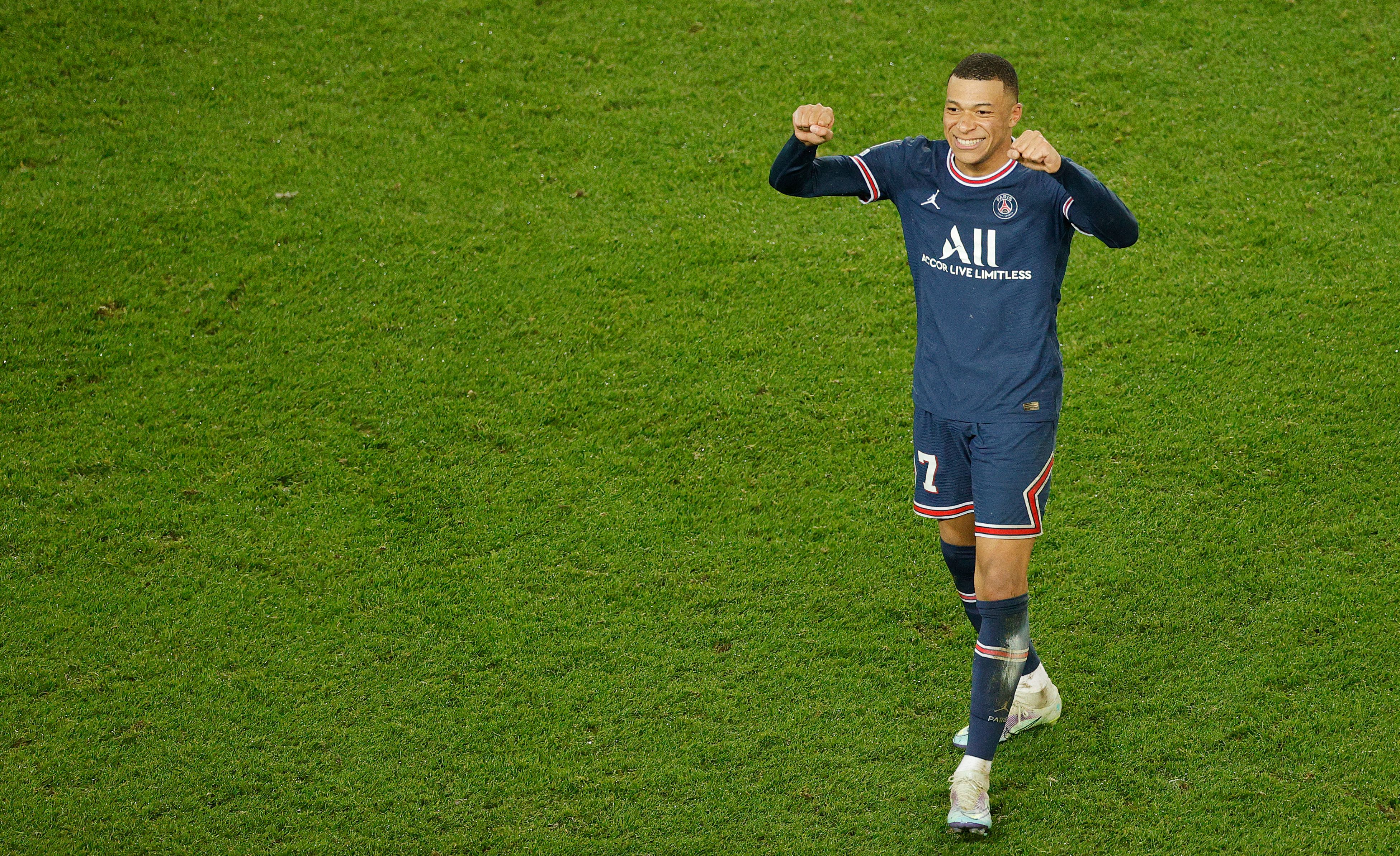 Paris Saint-Germain's French forward Kylian Mbappe celebrates after winning the UEFA Champions League round of 16 first leg football match between Paris Saint-Germain (PSG) and Real Madrid at the Parc des Princes stadium in Paris on February 15, 2022. (Photo by Geoffroy VAN DER HASSELT / AFP) (Photo by GEOFFROY VAN DER HASSELT/AFP via Getty Images)