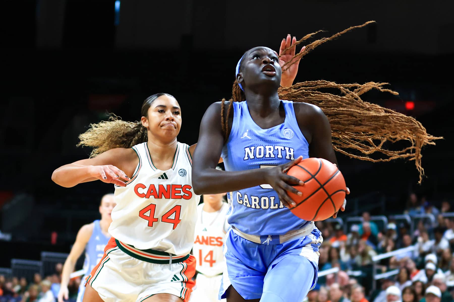 CORAL GABLES, FLORIDA - DECEMBER 29: Maria Gakdeng #5 of the North Carolina Tar Heels drives to the basket against the Miami Hurricanes during the first quarter of the game at Watsco Center on December 29, 2024 in Coral Gables, Florida. (Photo by Megan Briggs/Getty Images)