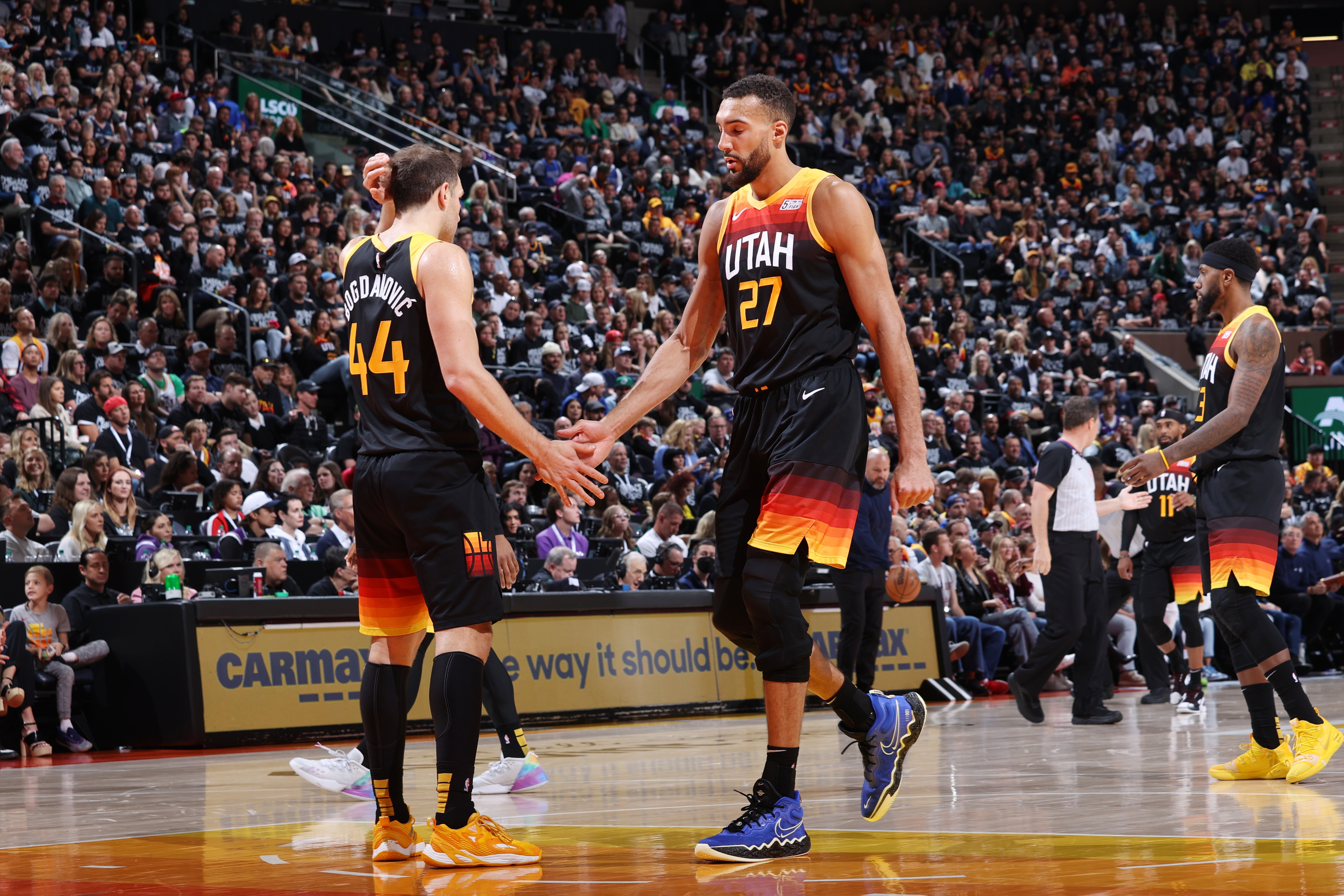 SALT LAKE CITY, UT - APRIL 28: Bojan Bogdanovic #44 and Rudy Gobert #27 of the Utah Jazz high five during Round 1 Game 6 of the 2022 NBA Playoffs against the Dallas Mavericks on April 28, 2022 at vivint.SmartHome Arena in Salt Lake City, Utah. NOTE TO USER: User expressly acknowledges and agrees that, by downloading and or using this Photograph, User is consenting to the terms and conditions of the Getty Images License Agreement. Mandatory Copyright Notice: Copyright 2022 NBAE (Photo by Melissa Majchrzak/NBAE via Getty Images)