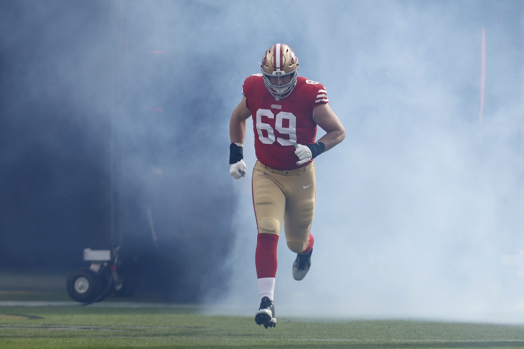 San Francisco 49ers offensive tackle Mike McGlinchey (69) is introduced before an NFL football game against the Miami Dolphins in Santa Clara, Calif., Sunday, Dec. 4, 2022. (AP Photo/Jed Jacobsohn)