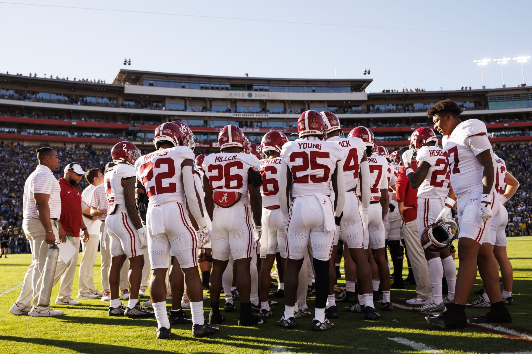 PASADENA, CALIFORNIA - JANUARY 01: The Alabama Crimson Tide huddle along the sideline during the CFP Semifinal Rose Bowl Game against the Michigan Wolverines at Rose Bowl Stadium on January 1, 2024 in Pasadena, California. (Photo by Ryan Kang/Getty Images)