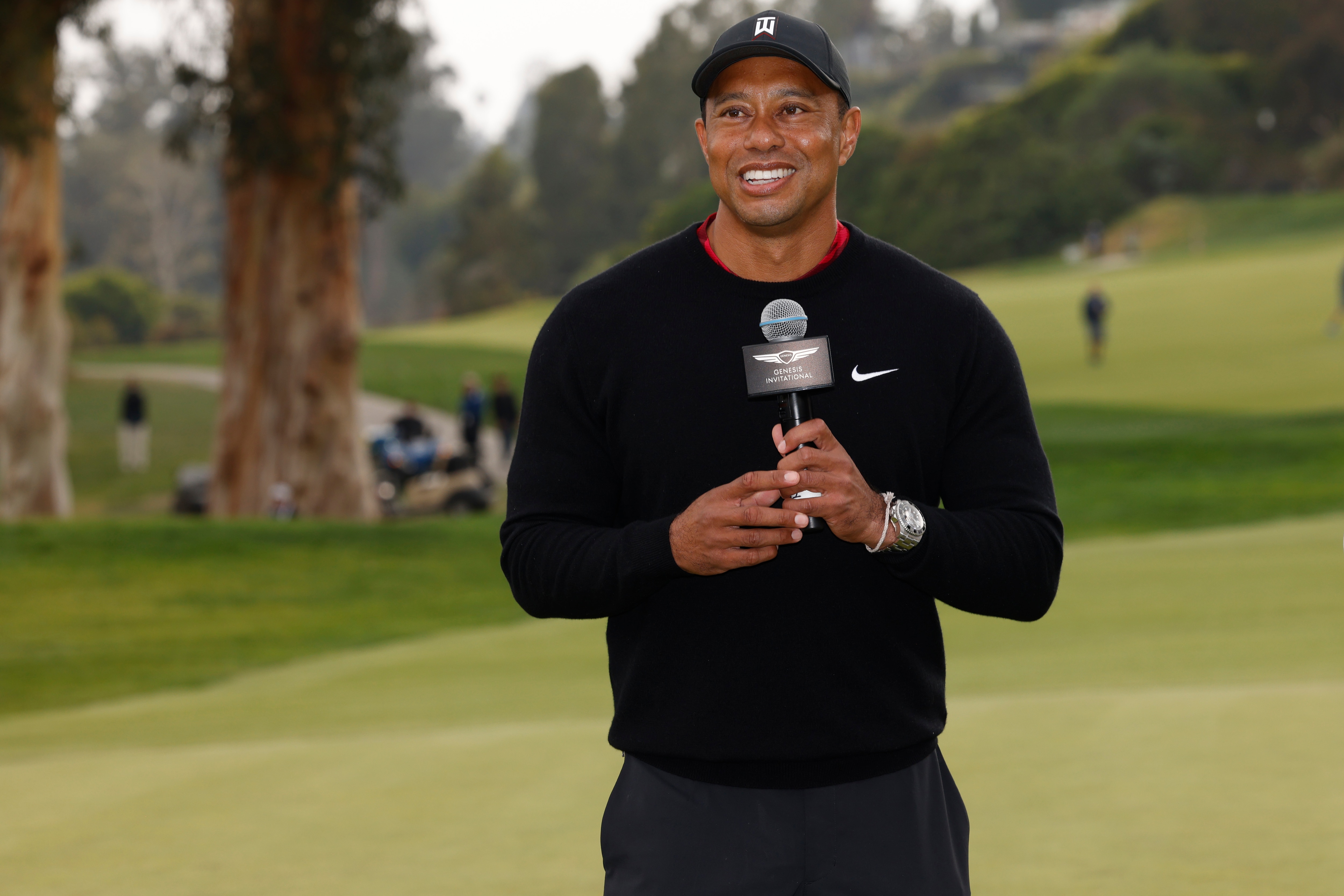 Tiger Woods speaks during the trophy ceremony on the 18th green after the Genesis Invitational golf tournament at Riviera Country Club, Sunday, Feb. 20, 2022, in the Pacific Palisades area of Los Angeles. (AP Photo/Ryan Kang)