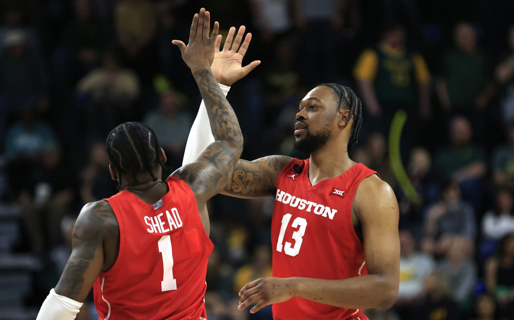 WACO, TX - FEBRUARY 24: Jamal Shead #1 of the Houston Cougars and teammate J'Wan Roberts #13 celebrate in the final seconds of the team's victory over the Baylor Bears in the second half at Foster Pavilion on February 24, 2024 in Waco, Texas. (Photo by Ron Jenkins/Getty Images)
