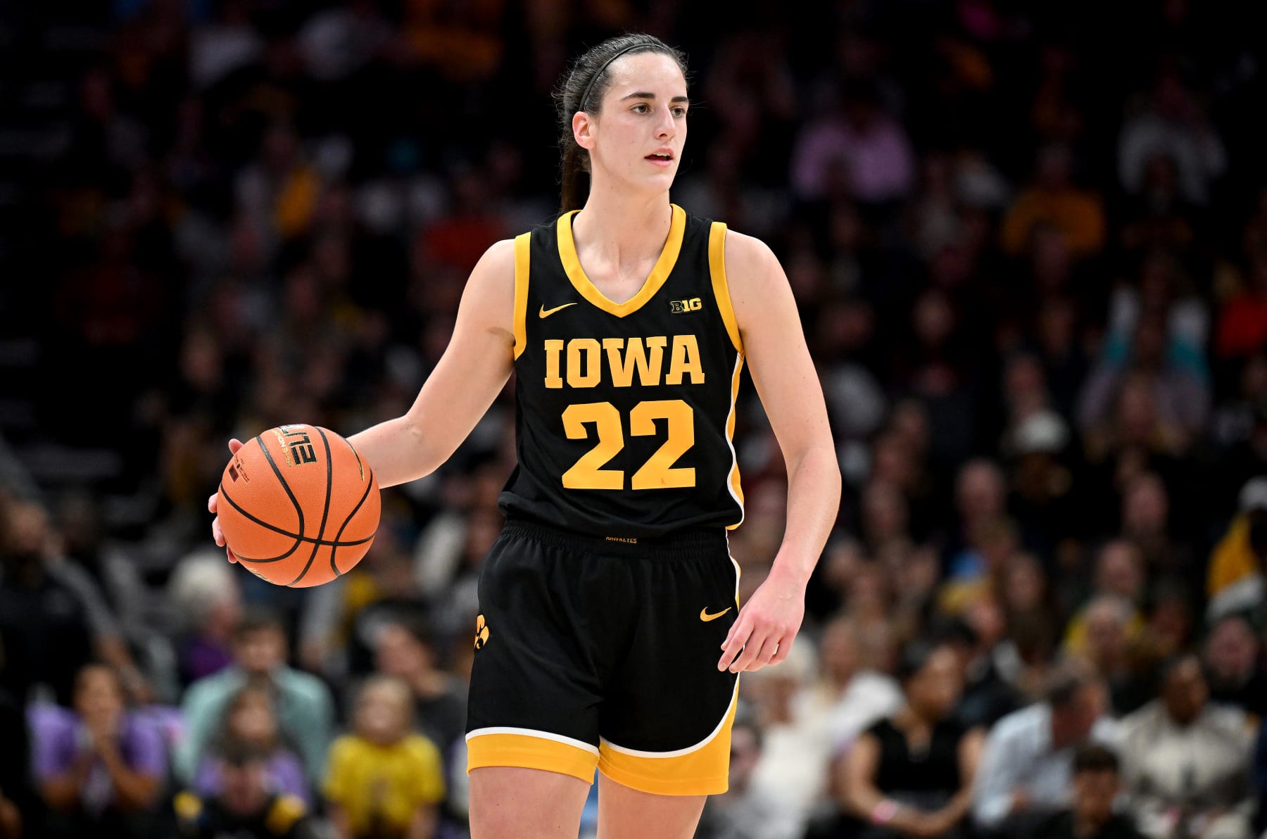 CHARLOTTE, NORTH CAROLINA - NOVEMBER 09: Caitlin Clark #22 of the Iowa Hawkeyes handles the ball against the Virginia Tech Hokies at Spectrum Center on November 09, 2023 in Charlotte, North Carolina. (Photo by G Fiume/Getty Images)