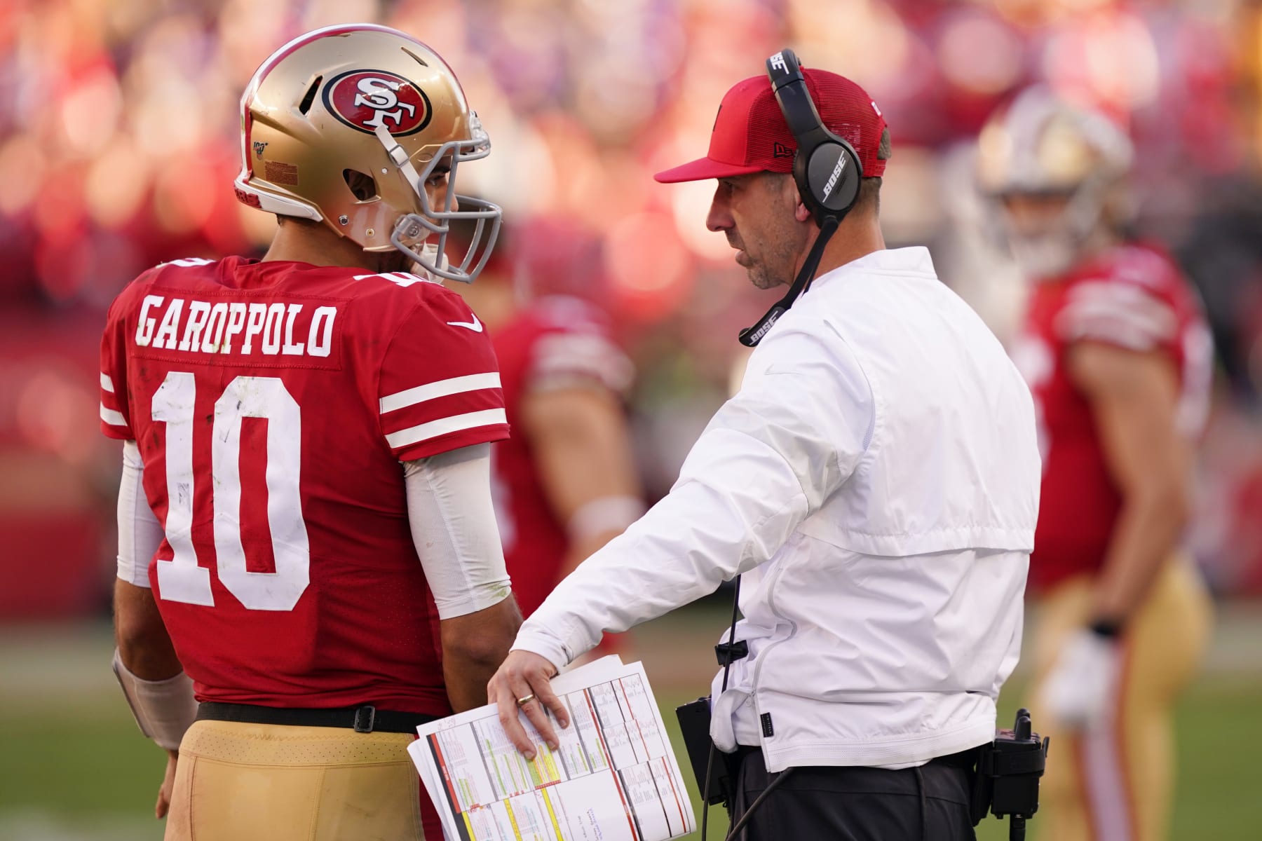 SANTA CLARA, CALIFORNIA - JANUARY 11: Jimmy Garoppolo #10 speaks with head coach Kyle Shanahan of the San Francisco 49ers during the NFC Divisional Round Playoff game against the Minnesota Vikings at Levi's Stadium on January 11, 2020 in Santa Clara, California. (Photo by Thearon W. Henderson/Getty Images)