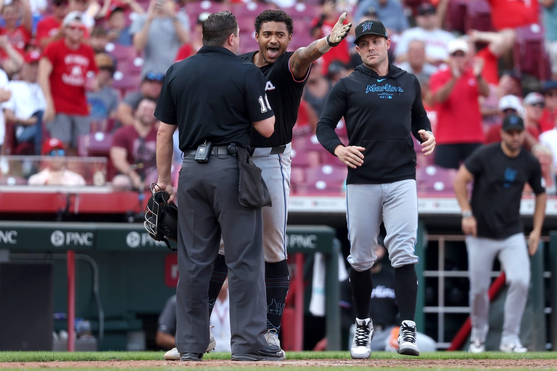 CINCINNATI, OHIO - JULY 13:  Dane Myers #54 of the Miami Marlins argues with home plate umpire Derek Thomas #106 after being thrown out of the game during the eighth inning of the game against the Cincinnati Reds at Great American Ball Park on July 13, 2024 in Cincinnati, Ohio. Cincinnati defeated Miami 10-6. (Photo by Kirk Irwin/Getty Images)