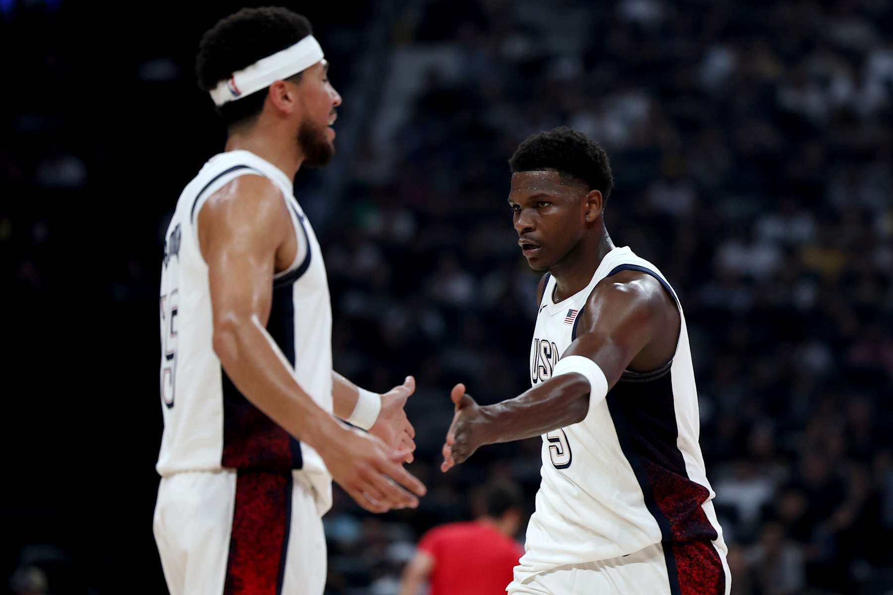 ABU DHABI, UNITED ARAB EMIRATES - JULY 17: Anthony Edwards #5 and Devin Booker #15 of the United States during the first half of an exhibition game between the United States and Serbia ahead of the Paris Olympic Games at Etihad Arena on July 17, 2024 in Abu Dhabi, United Arab Emirates. (Photo by Christopher Pike/Getty Images)