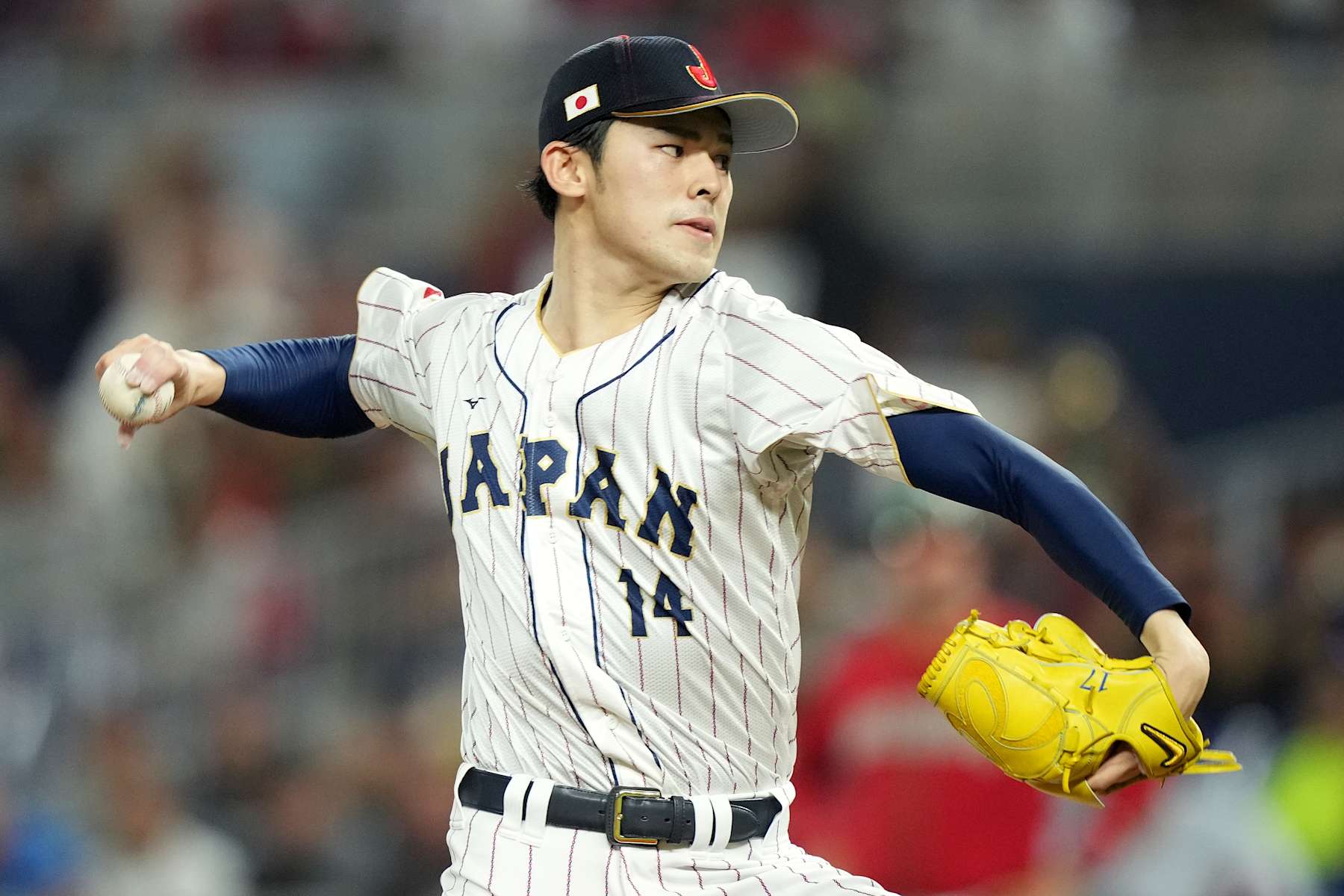 MIAMI, FLORIDA - MARCH 20: Roki Sasaki #14 of Team Japan pitches in the first inning against Team Mexico during the World Baseball Classic Semifinals at loanDepot park on March 20, 2023 in Miami, Florida. (Photo by Eric Espada/Getty Images)