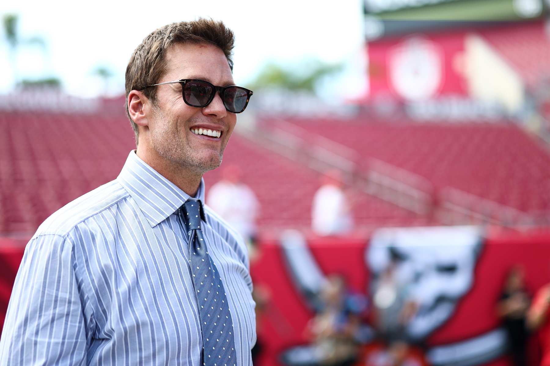 TAMPA, FL - SEPTEMBER 29: Fox Sports commentator and former NFL quarterback Tom Brady smiles prior to an NFL football game between the Tampa Bay Buccaneers and the Philadelphia Eagles at Raymond James Stadium on September 29, 2024 in Tampa, Florida. (Photo by Kevin Sabitus/Getty Images)