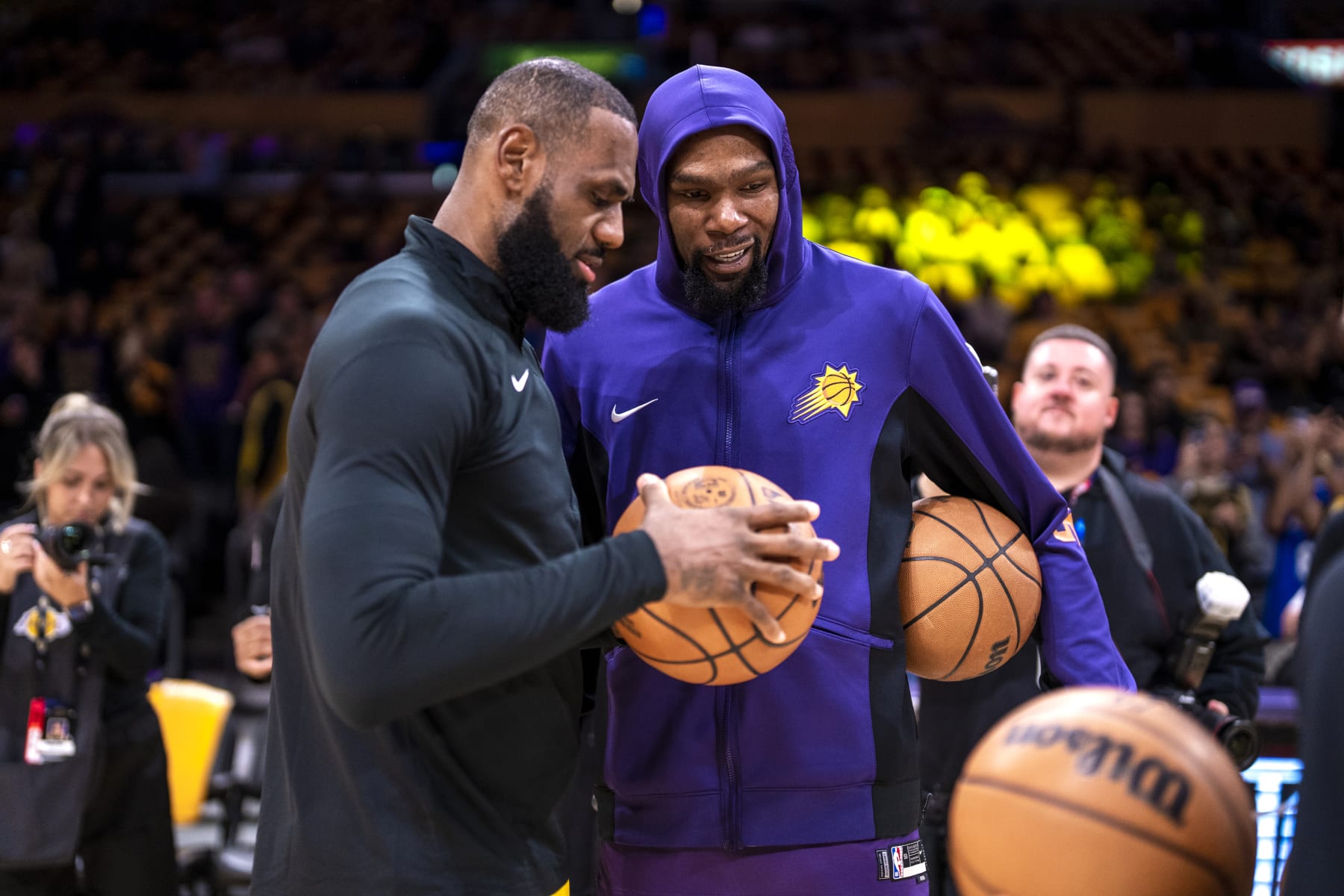 LOS ANGELES, CA - OCTOBER 26: LeBron James #23 of the Los Angeles Lakers and Kevin Durant #35 of the Phoenix Suns speak before the game on October 26, 2023 at Crypto.Com Arena in Los Angeles, California. NOTE TO USER: User expressly acknowledges and agrees that, by downloading and/or using this Photograph, user is consenting to the terms and conditions of the Getty Images License Agreement. Mandatory Copyright Notice: Copyright 2023 NBAE (Photo by Tyler Ross/NBAE via Getty Images)