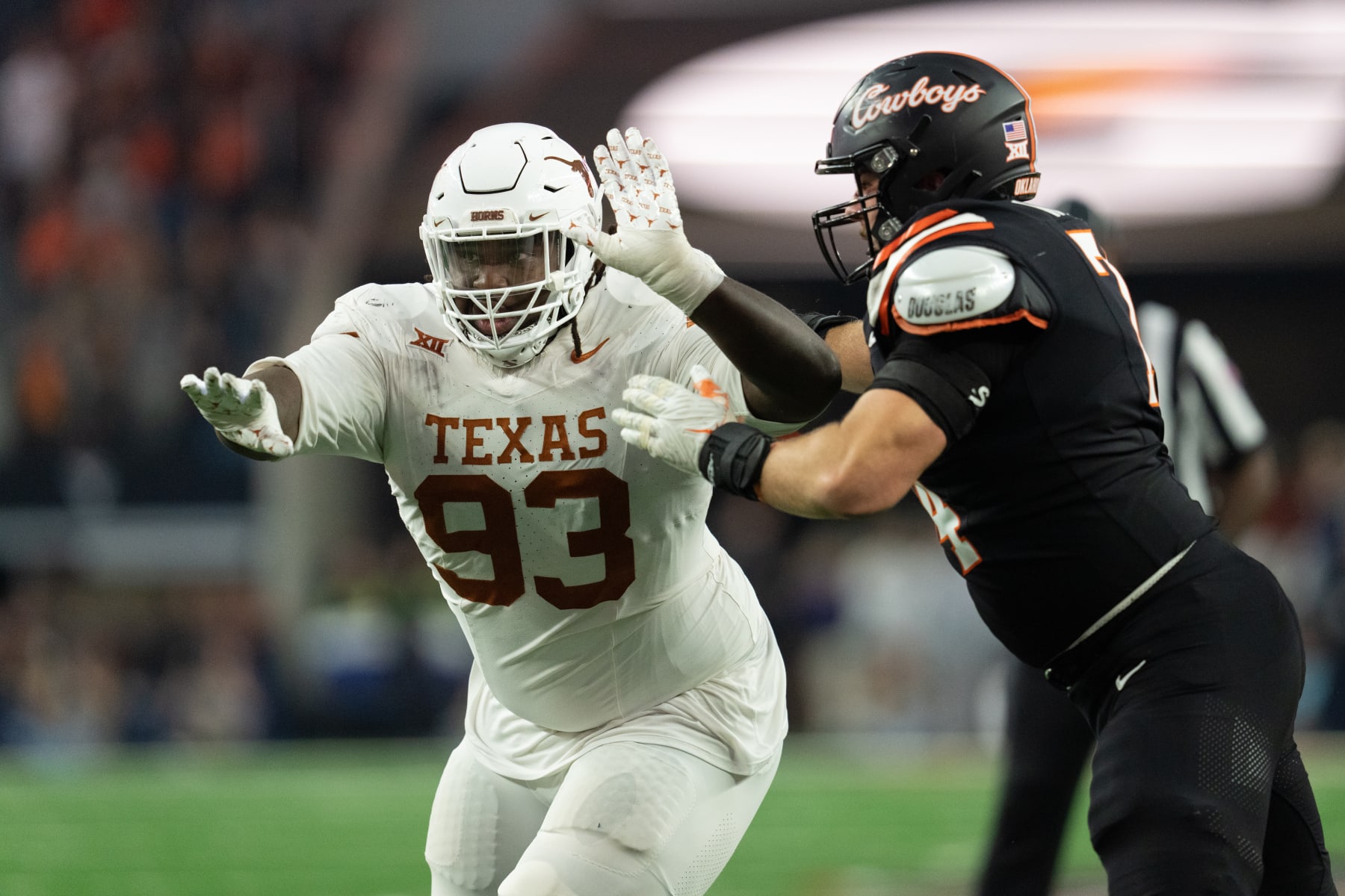 ARLINGTON, TEXAS - DECEMBER 2: T'Vondre Sweat #93 of the Texas Longhorns rushes the passer at the Big 12 Championship match between Oklahoma State and Texasat AT&T Stadium on December 2, 2023 in Arlington, Texas. (Photo by Caten Hyde/The University of Texas Athletics/Getty Images)