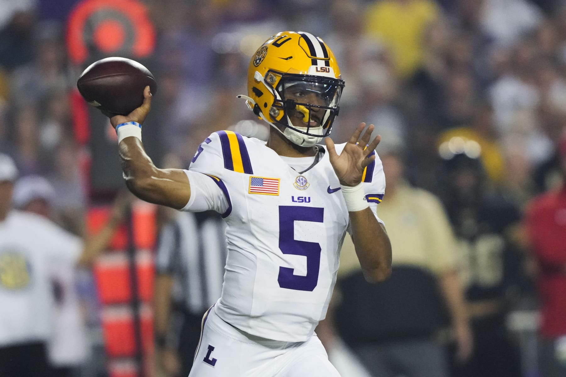 LSU quarterback Jayden Daniels (5) passes in the first half of an NCAA college football game against Army in Baton Rouge, La., Saturday, Oct. 21, 2023. (AP Photo/Gerald Herbert) LSU quarterback Jayden Daniels (5) passes in the first half of an NCAA college football game against Army in Baton Rouge, La., Saturday, Oct. 21, 2023. (AP Photo/Gerald Herbert)
