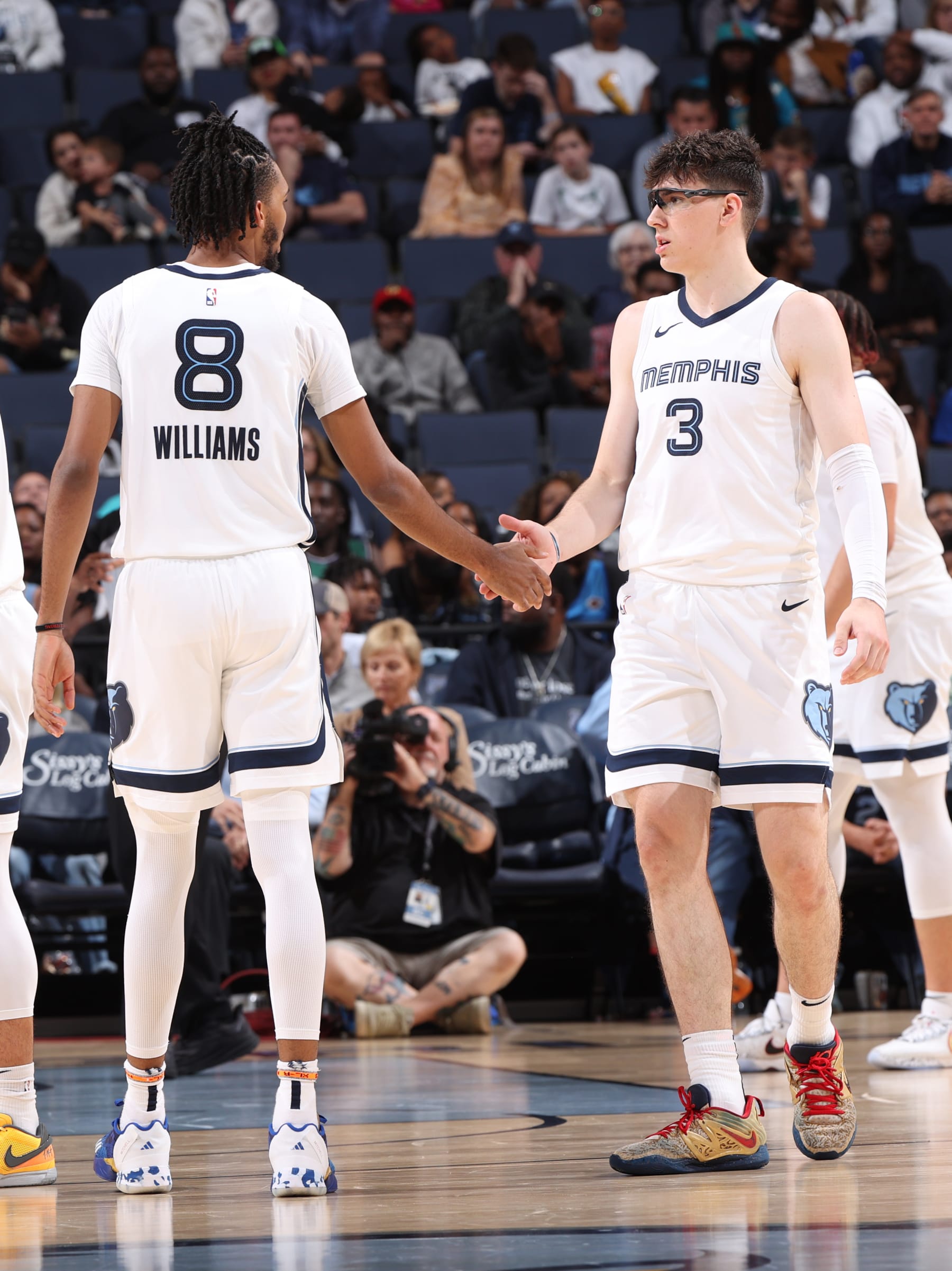 MEMPHIS, TN - OCTOBER 10: Ziaire Williams #8 high fives Jake LaRavia #3 of the Memphis Grizzlies at the game against the Milwaukee Bucks on October 10, 2023 at FedExForum in Memphis, Tennessee. NOTE TO USER: User expressly acknowledges and agrees that, by downloading and or using this photograph, User is consenting to the terms and conditions of the Getty Images License Agreement. Mandatory Copyright Notice: Copyright 2023 NBAE (Photo by Joe Murphy/NBAE via Getty Images)