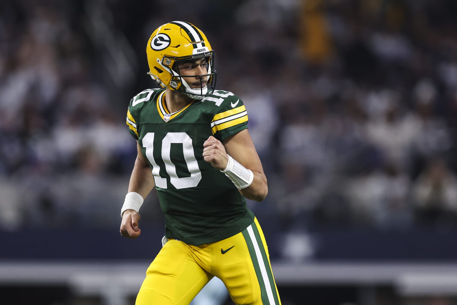 ARLINGTON, TX - JANUARY 14: Jordan Love #10 of the Green Bay Packers celebrates during an NFL wild-card playoff football game against the Dallas Cowboys at AT&T Stadium on January 14, 2024 in Arlington, Texas. (Photo by Perry Knotts/Getty Images)