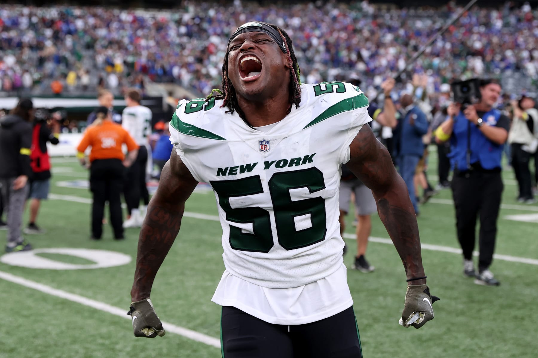EAST RUTHERFORD, NEW JERSEY - NOVEMBER 06: Quincy Williams #56 of the New York Jets celebrates after beating the Buffalo Bills 20-17 at MetLife Stadium on November 06, 2022 in East Rutherford, New Jersey. (Photo by Elsa/Getty Images)