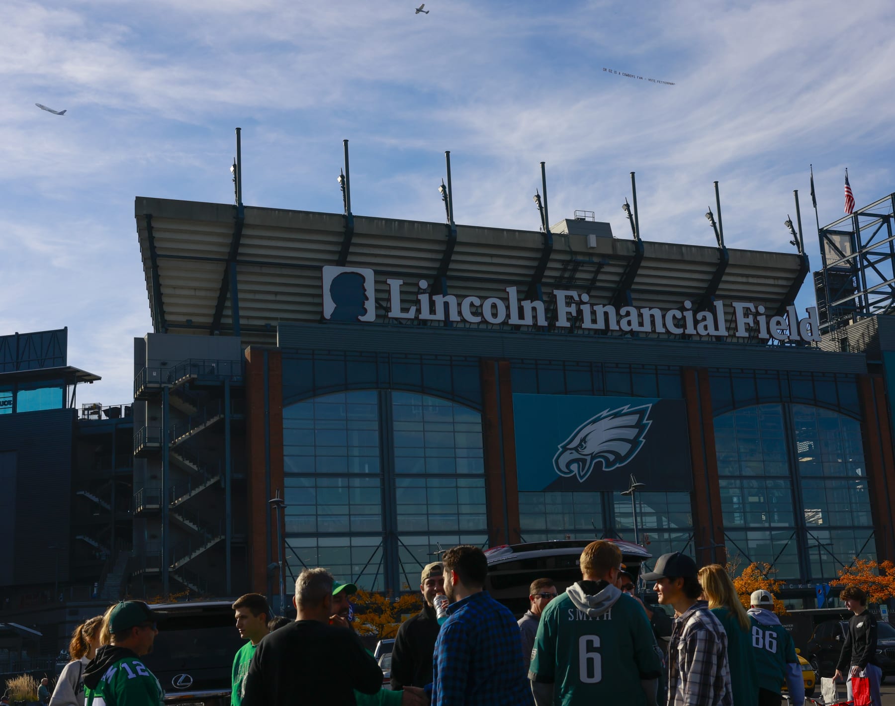 IMAGE DISTRIBUTED FOR MAKE THE ROAD ACTION - A plane tows a banner reading "DR OZ IS A COWBOYS FAN - VOTE FETTERMAN!" on Sunday, October 30, 2022 before an NFL game at Lincoln Financial Field in south Philadelphia. (Jason E. Miczek/AP Images for Make the Road Action)