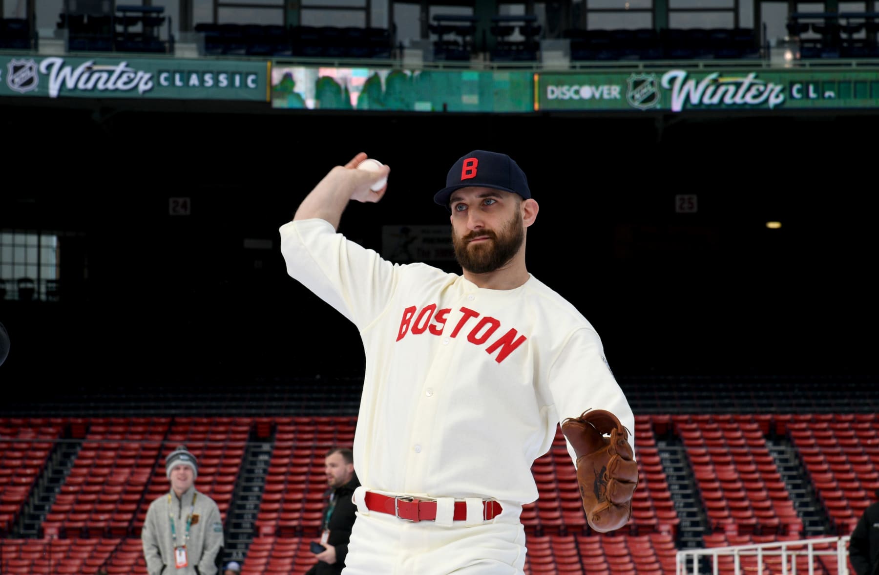 BOSTON, MASSACHUSETTS - JANUARY 02: Nick Foligno #17 of the Boston Bruins throws a baseball on the field prior to the 2023 Discover NHL Winter Classic game between the Pittsburgh Penguins and the Boston Bruins at Fenway Park on January 02, 2023 in Boston, Massachusetts. (Photo by Brian Babineau/NHLI via Getty Images)