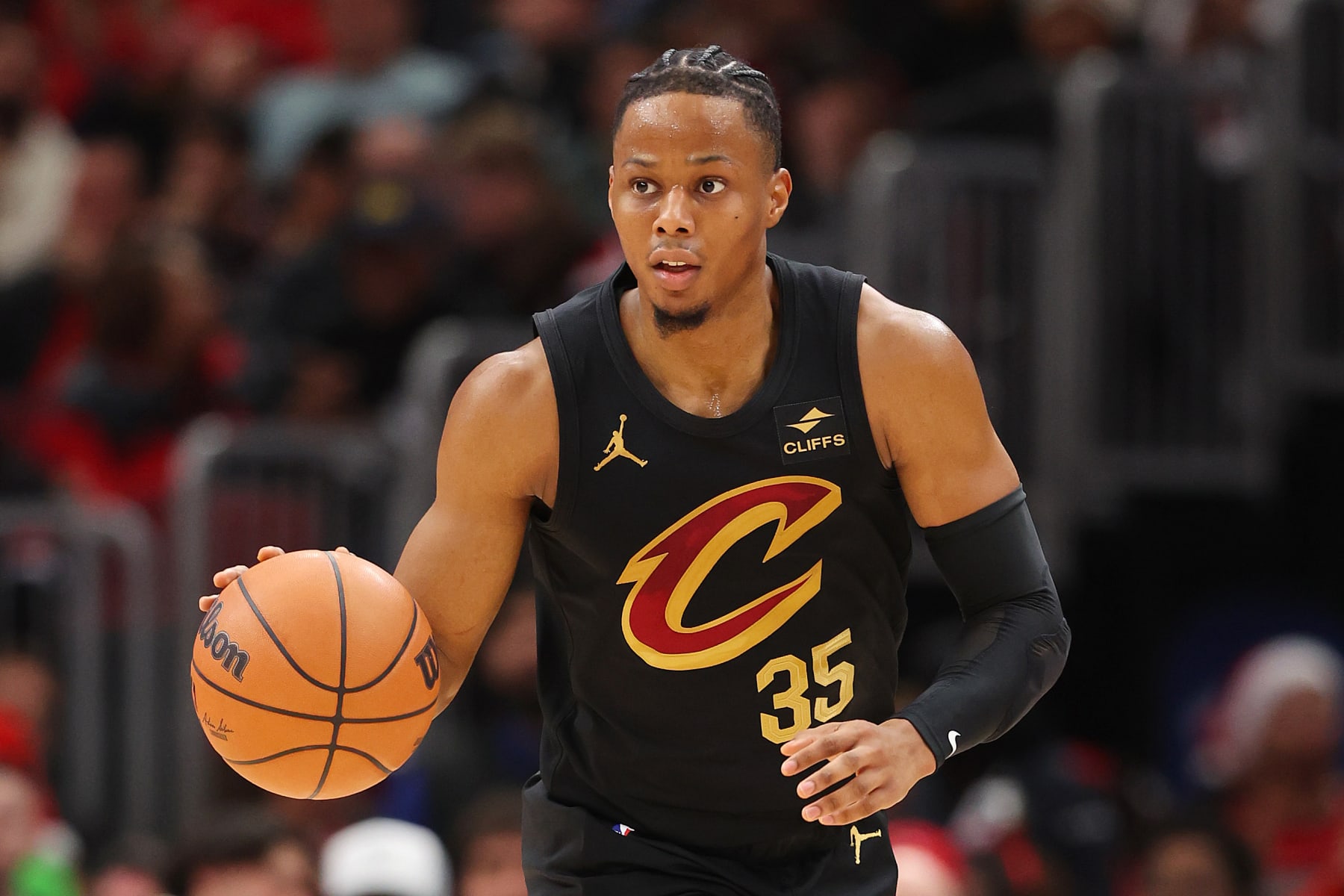 CHICAGO, ILLINOIS - DECEMBER 23: Isaac Okoro #35 of the Cleveland Cavaliers dribbles up the court against the Chicago Bulls during the first half at the United Center on December 23, 2023 in Chicago, Illinois. NOTE TO USER: User expressly acknowledges and agrees that, by downloading and or using this photograph, User is consenting to the terms and conditions of the Getty Images License Agreement.  (Photo by Michael Reaves/Getty Images)